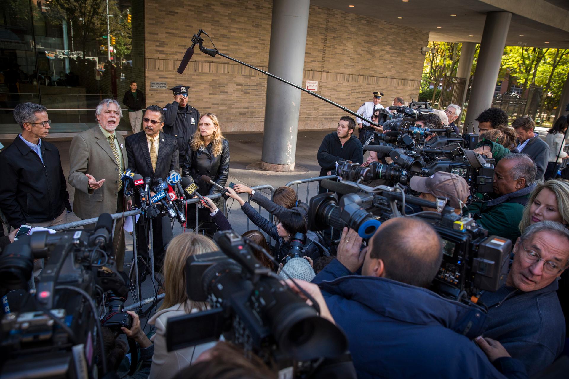 Housing Works CEO Charles King, second from left, speaks out against the current quarantine rules put into effect in New York and New Jersey following Ebola fears in the region outside of Bellevue Hospital in New York on October 27, 2014.
