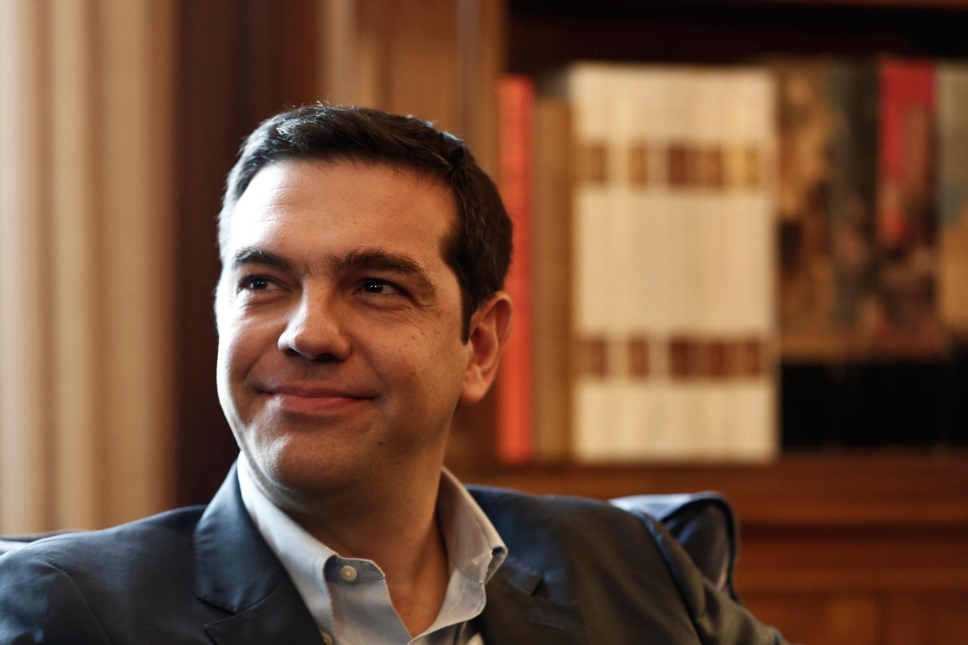 Alexis Tsipras, leader of Greece's far-left Syriza party smiles during a meeting with Greek President Karolos Papoulias (not pictured) at the Presidential palace in Athens November 3, 2014. 