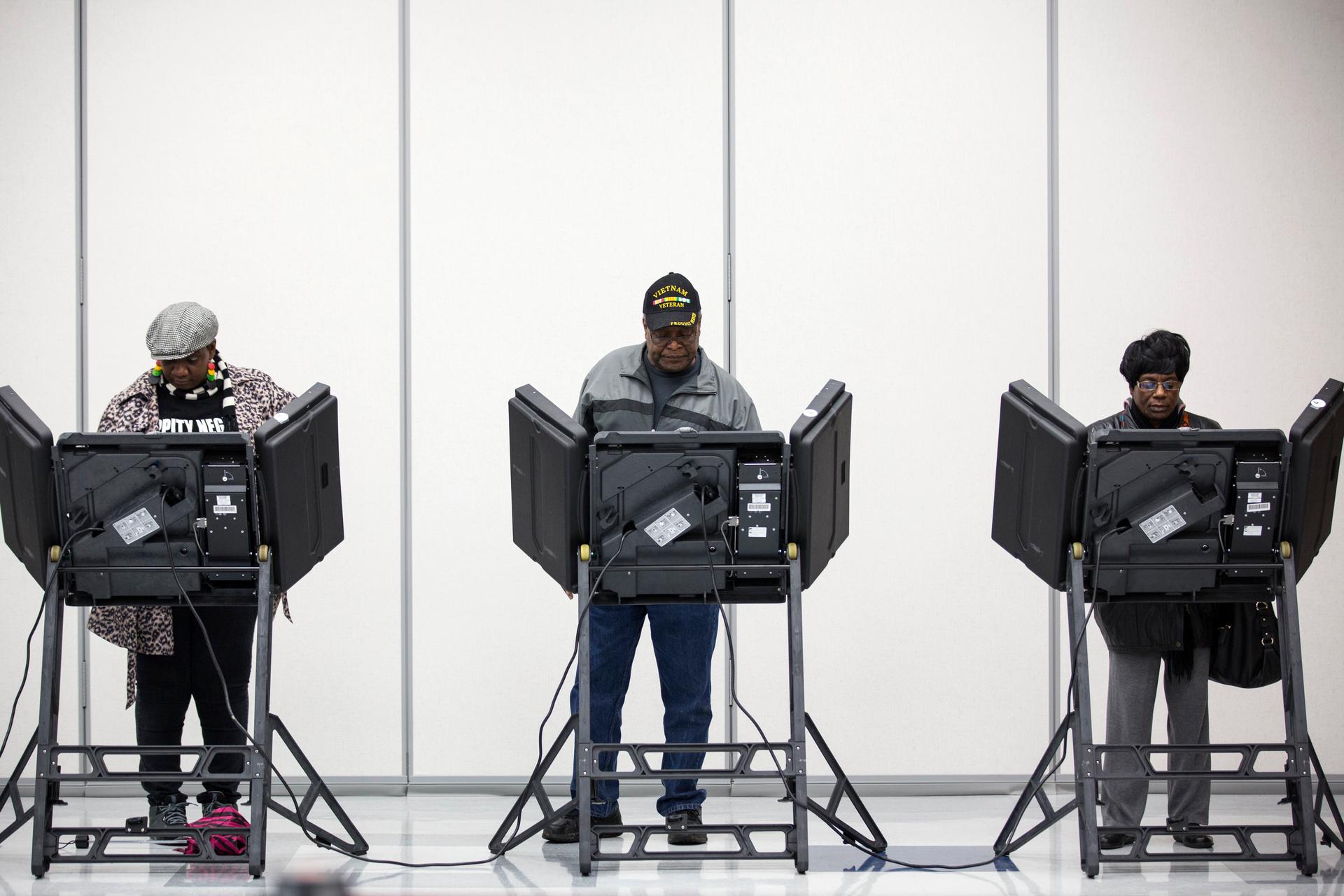 Voters cast their ballots in US midterm elections in Ferguson, Missouri, on November 4, 2014. 