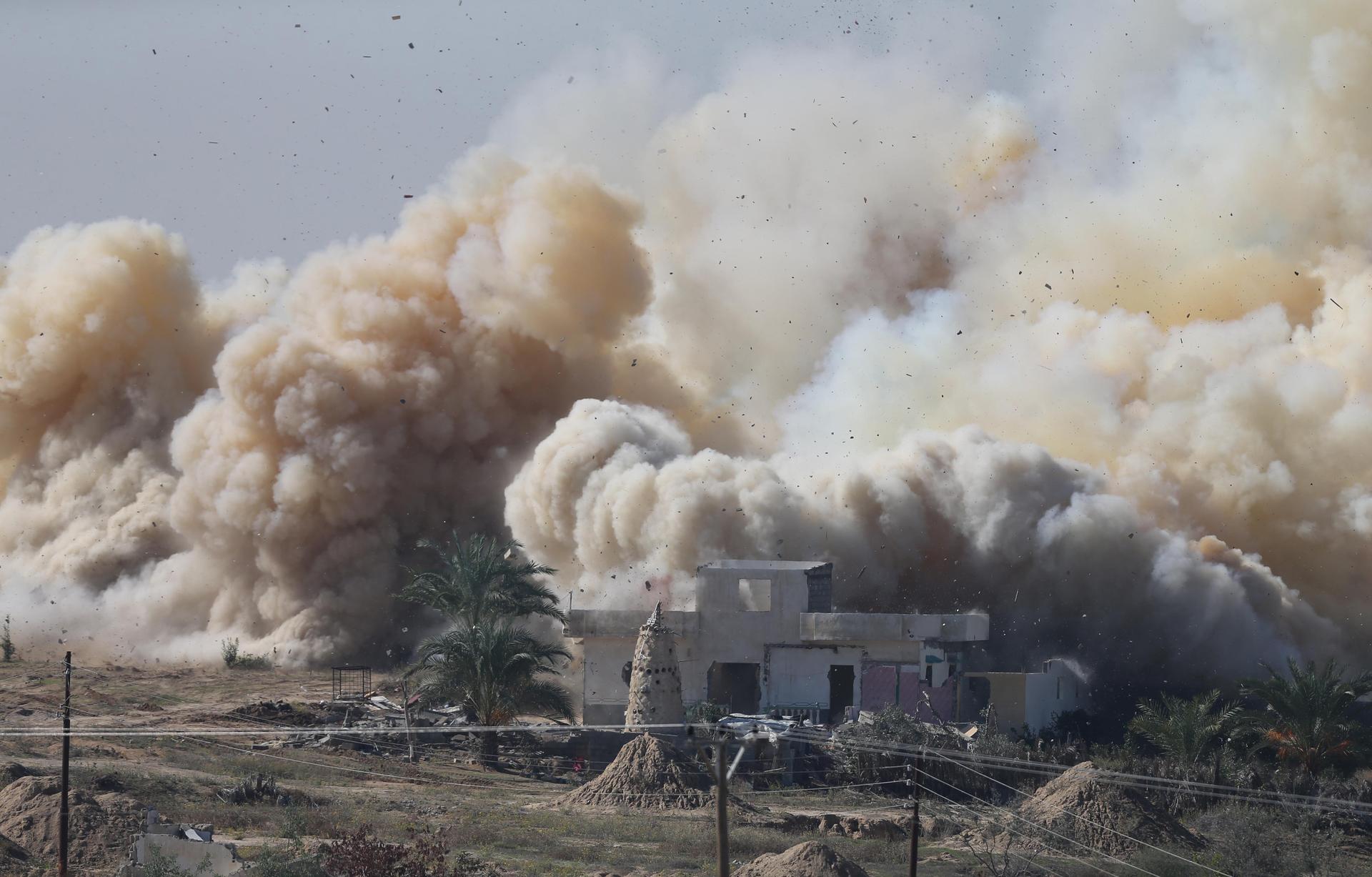 Smoke rises as a house is blown up by Egyptian security forces in northern Sinai. The government is trying to choke off the militant group, Ansar Bayt al-Maqdis, which has pledged its allegiance to ISIS. 
