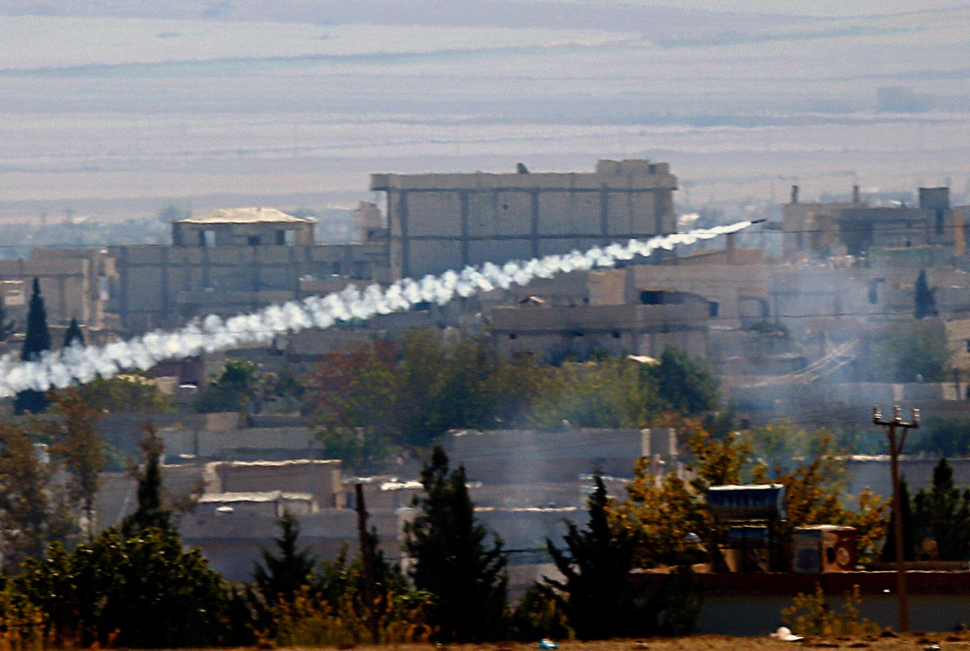 A rocket believed to have been launched by Islamic State forces flies from the east to the west side of the Syrian town of Kobani during fighting on November 6, 2014. Picture taken from the Turkish side of the Turkey-Syria border.