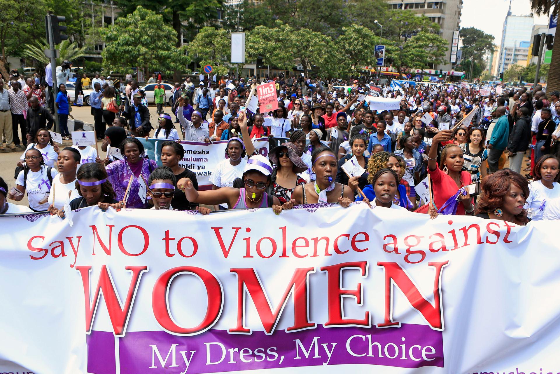 Kenyan women take part in a protest along a main street in the Kenyan capital of Nairobi on November 17, 2014. They were demanding justice for a woman who was attacked and stripped recently by men who claimed that she was dressed indecently.