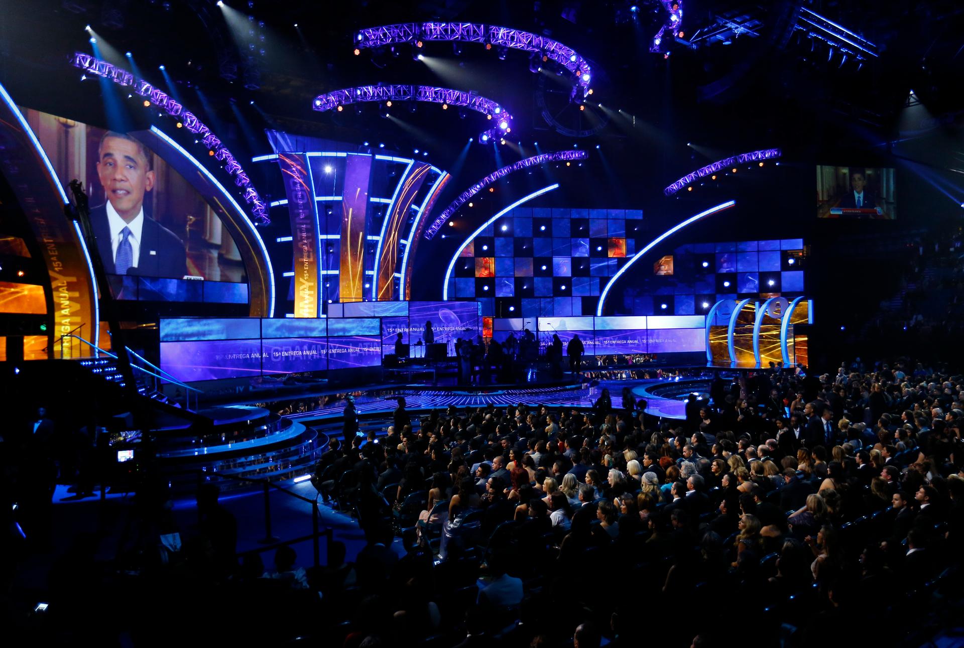 President Barack Obama is shown on a large screen as he delivers his immigration speech from the White House before the start of the 15th Annual Latin Grammy Awards in Las Vegas on November 20, 2014.