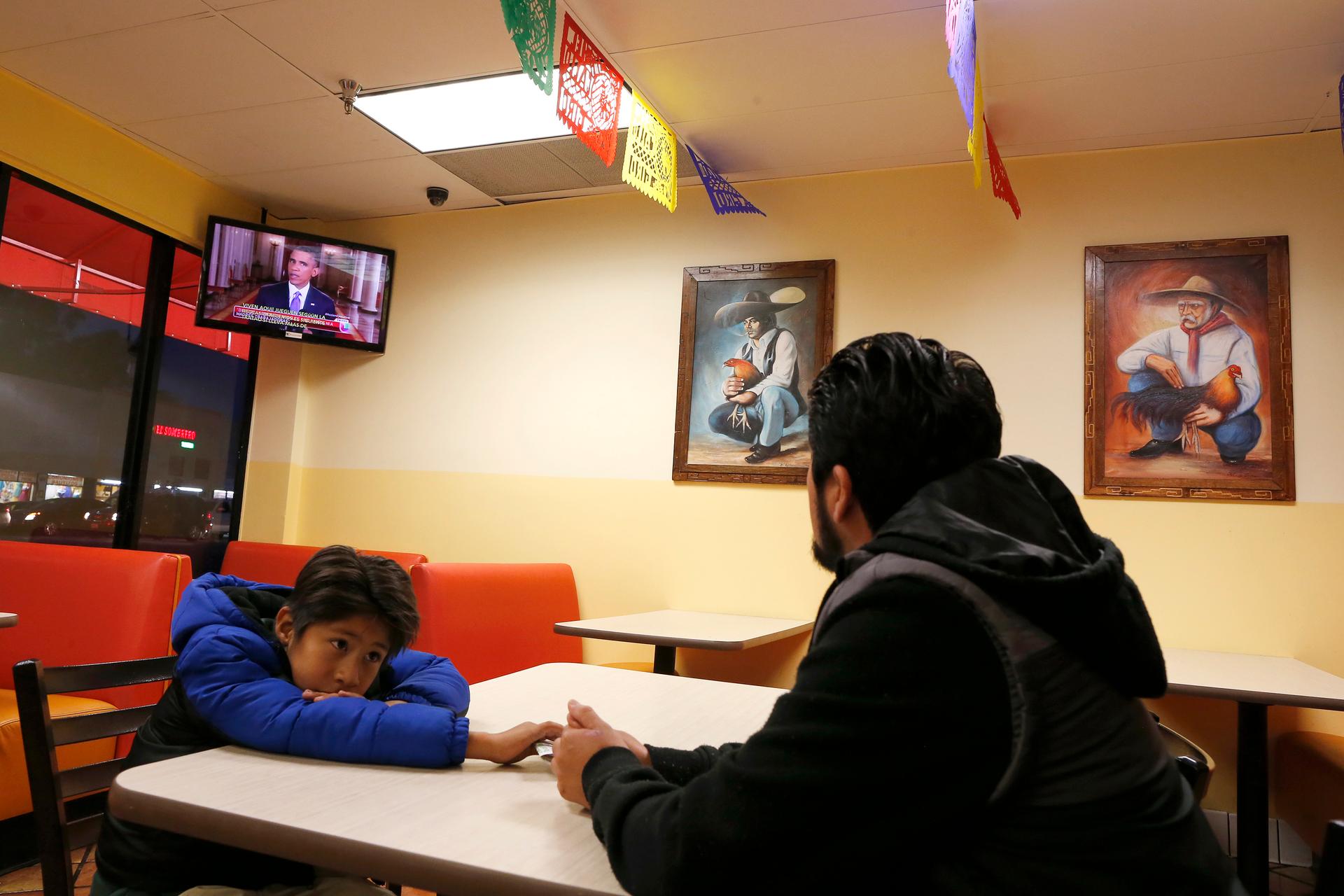 Esteban Cabanas, 30, an undocumented immigrant from Mexico, watches President Barack Obama's White House immigration speech on Thursday,