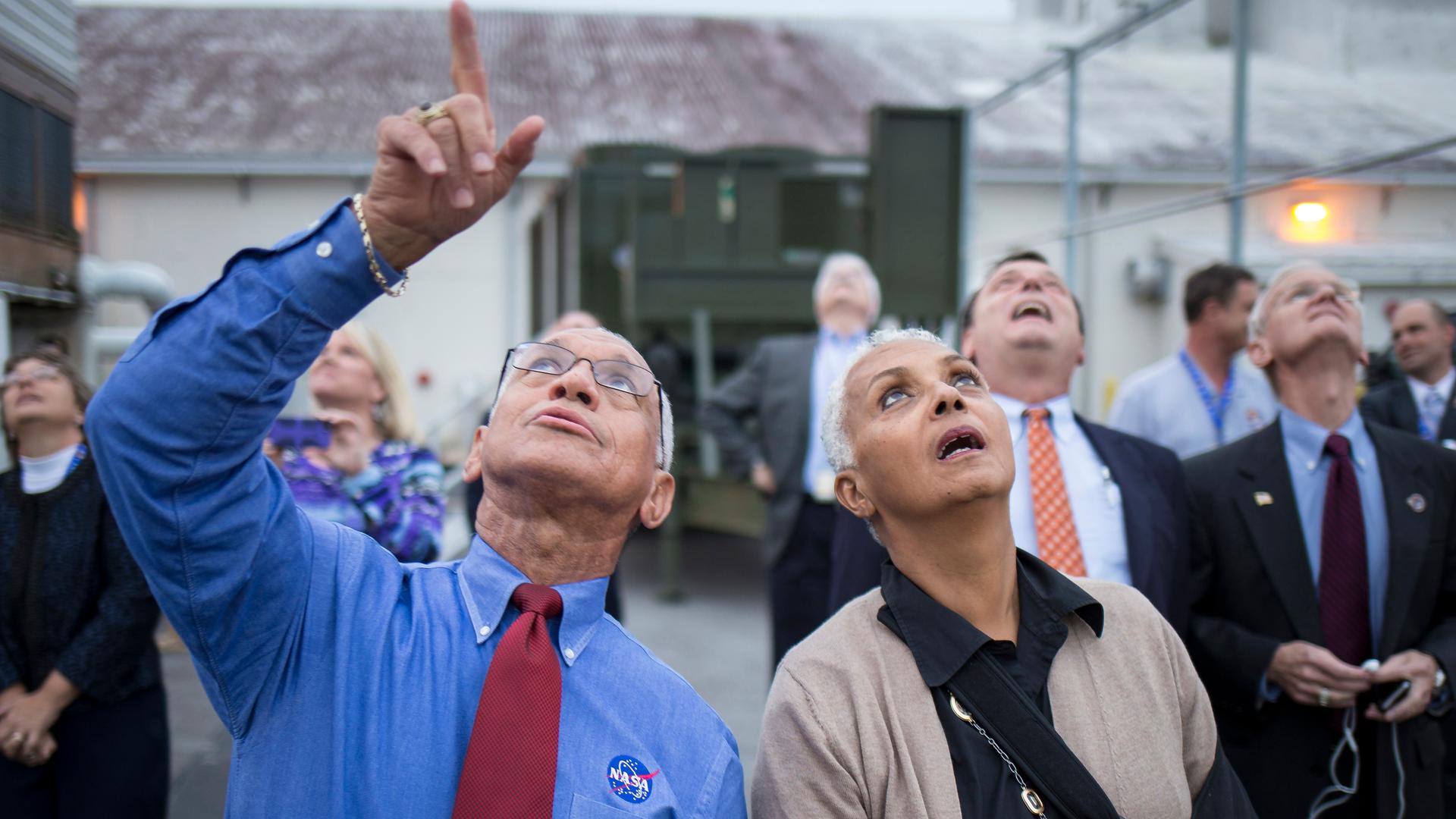 NASA Administrator Charles Bolden and his wife, Jackie, watch as the Delta IV Heavy rocket with the Orion spacecraft lifts off on December 5, 2014. 