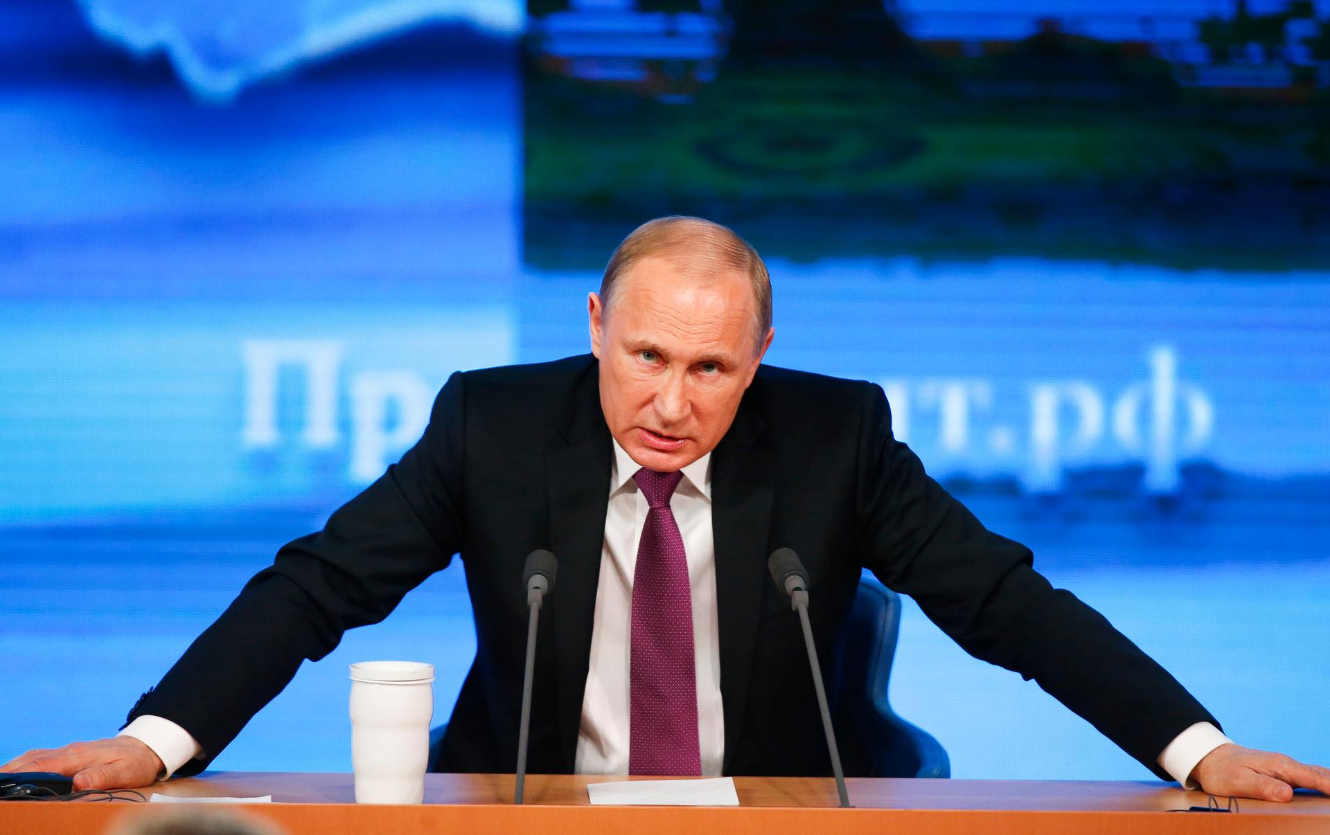 Russian President Vladimir Putin speaks during his annual end-of-year news conference in Moscow on December 18, 2014. 