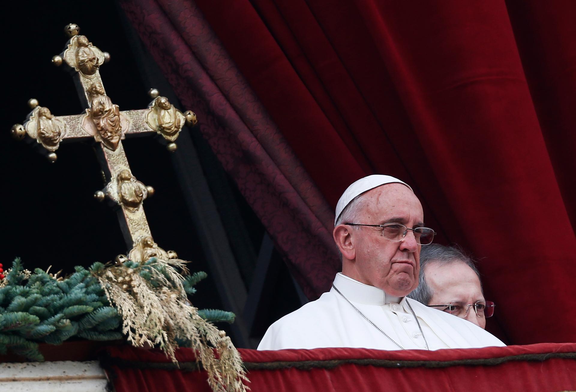 Pope Francis delivers a "Urbi et Orbi" (to the city and world) message from the balcony overlooking St. Peter's Square at the Vatican on Christmas Day of 2014.