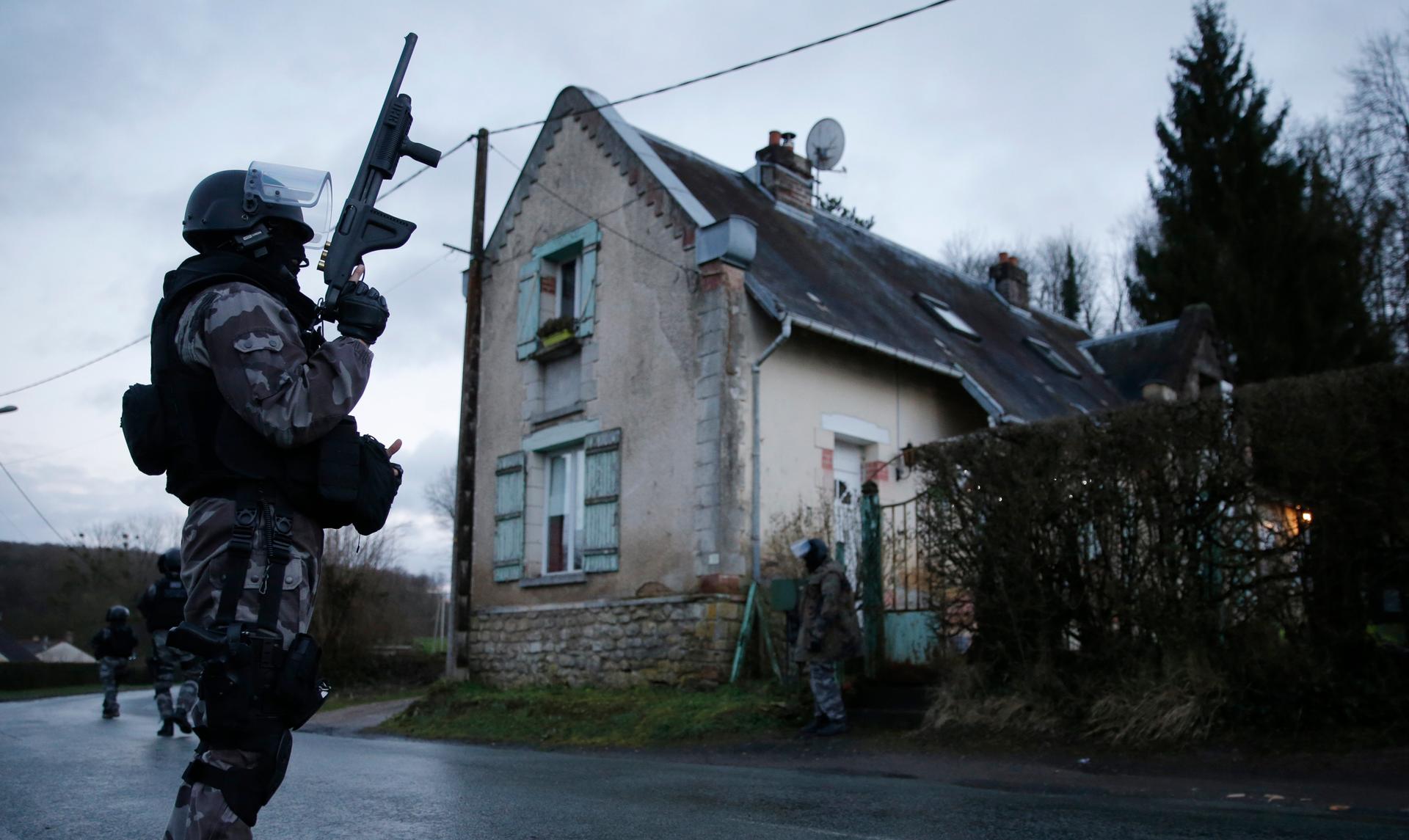 Members of the French GIPN intervention police forces secure a neighbourhood in Corcy, northeast of Paris. 