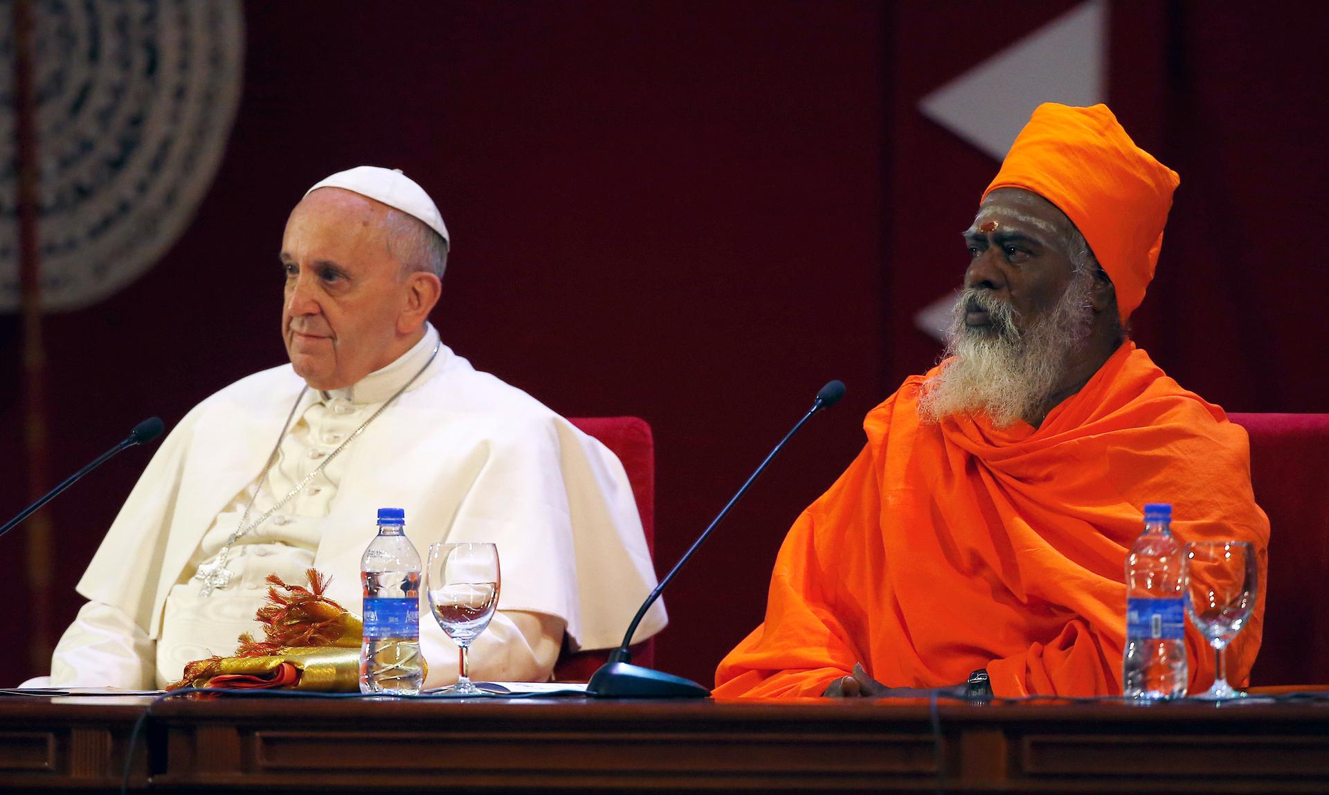 Pope Francis sits next to Hindu leader Ndu-Kurukkal SivaSri T. Mahadeva during the Interreligious Encounter in Colombo, Sri Lanka on January 13, 2015.