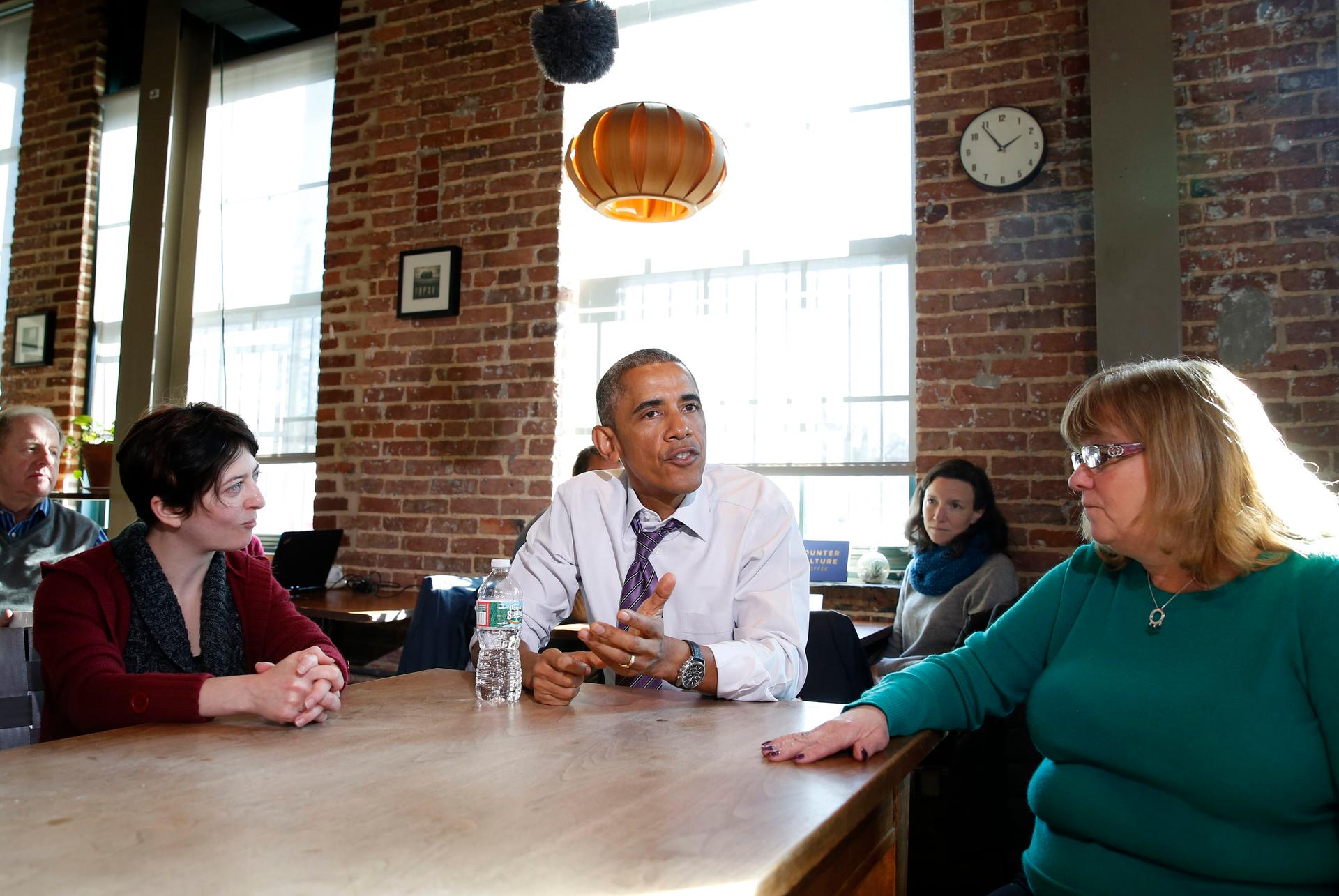 President Barack Obama talks about legislation to offer paid sick leave for Americans while at Charmington's Cafe in Baltimore, Maryland, on January 15, 2015.