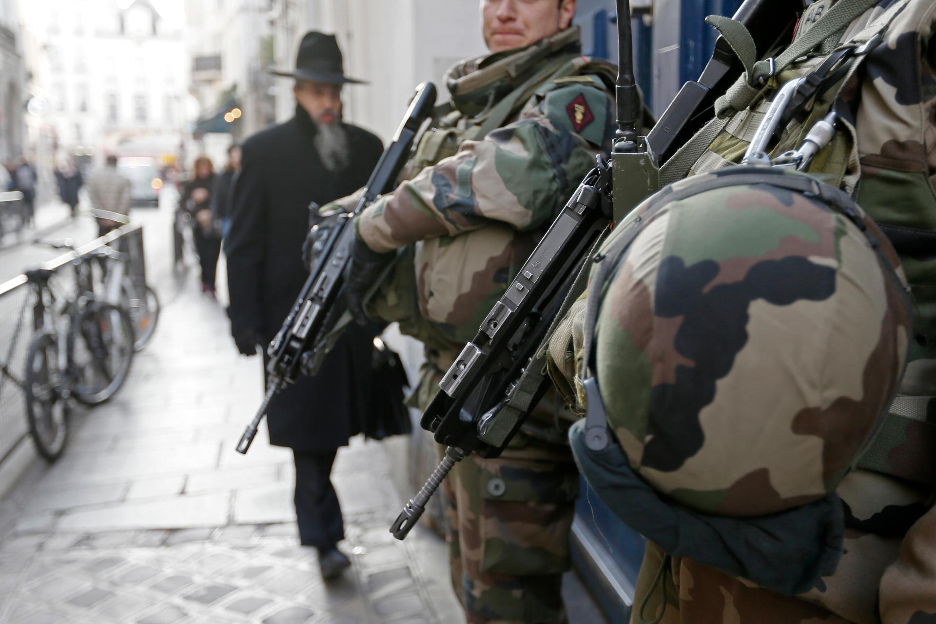 rench soldiers patrol the street in a Jewish neighbourhood near a religious school and a synagogue as part of the highest level of "Vigipirate" security plan after the Islamist attacks in Paris January 20, 2015. 