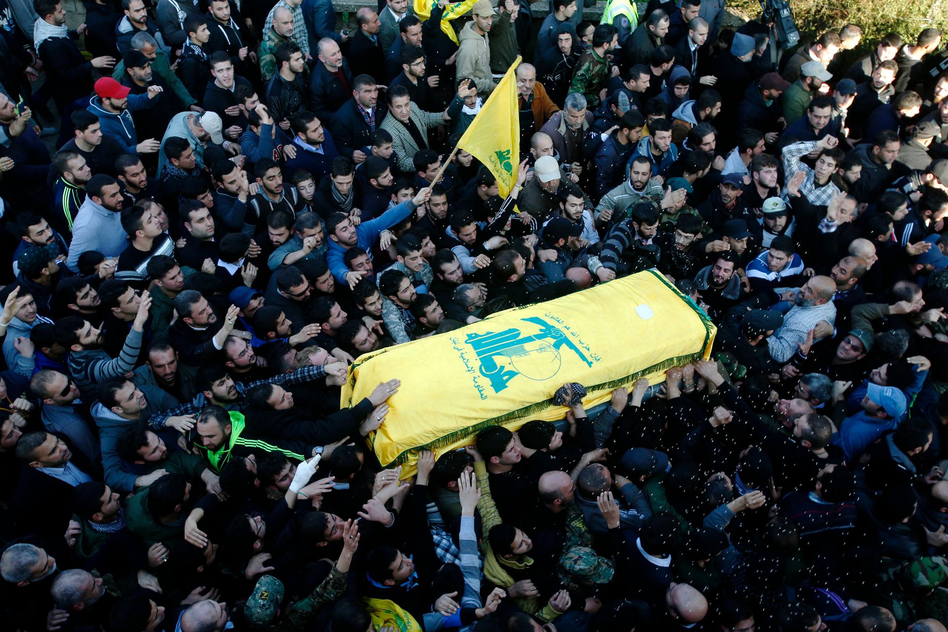 Members and supporters of Lebanon's Hezbollah commander Mohamad Issa, known as Abu Issa, carry his coffin during his funeral in Arab-Salim in south Lebanon on January 20, 2015. He was killed in an alleged Israeli airstrike in Syria on January 18.