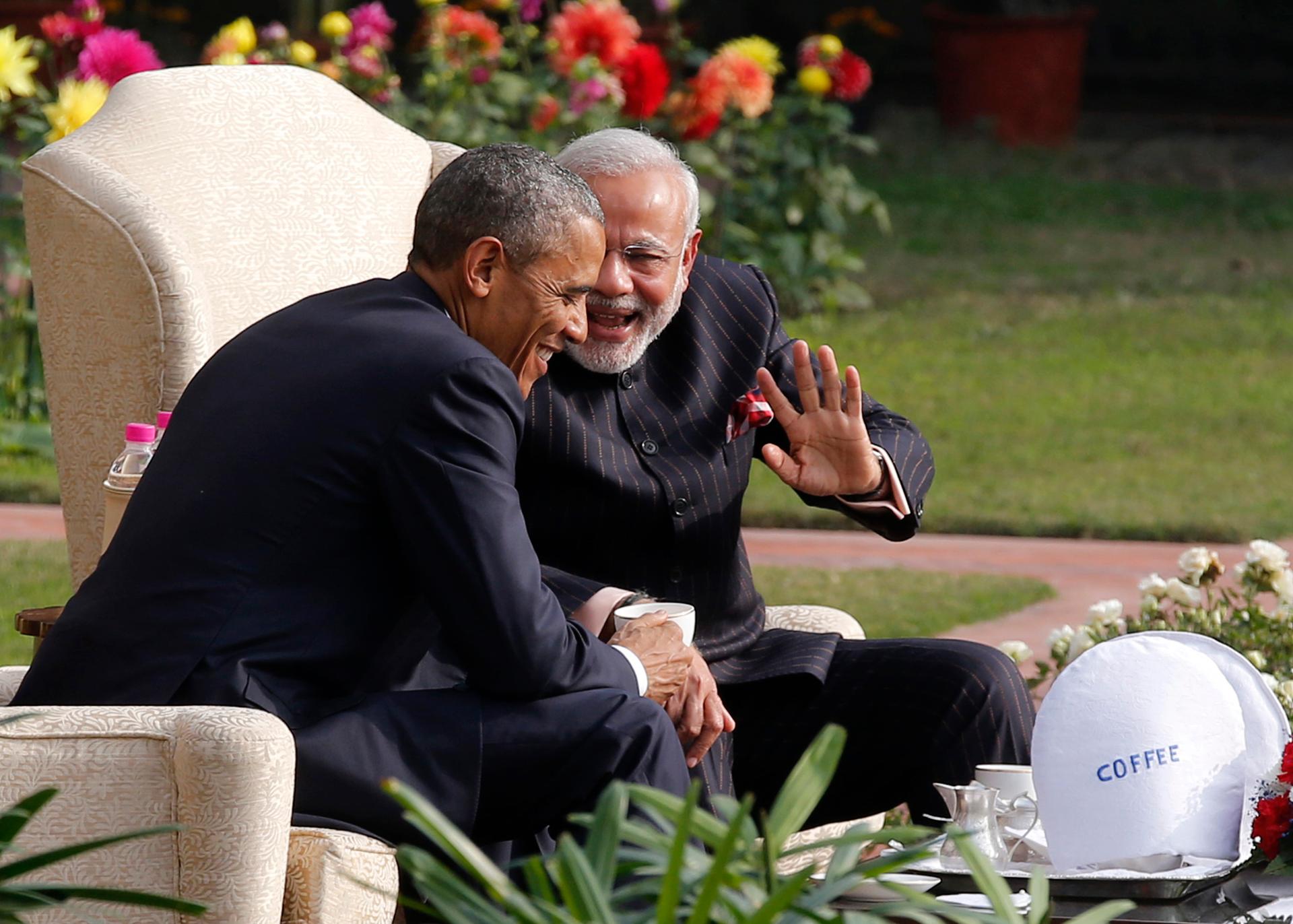 President Barack Obama and India's prime minister, Narendra Modi, talk as they have coffee and tea together in the gardens of Hyderabad House in New Delhi on January 25, 2015. Obama is visiting India for three days to attend Republic Day celebrations and 