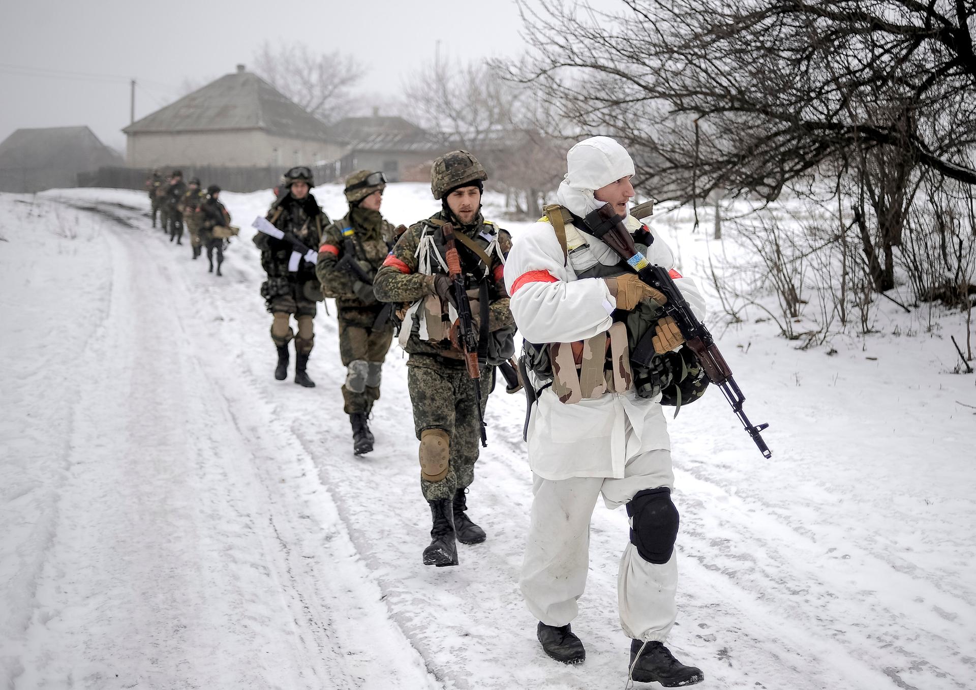 Ukrainian servicemen patrol a village in the Luhansk region of eastern Ukraine.