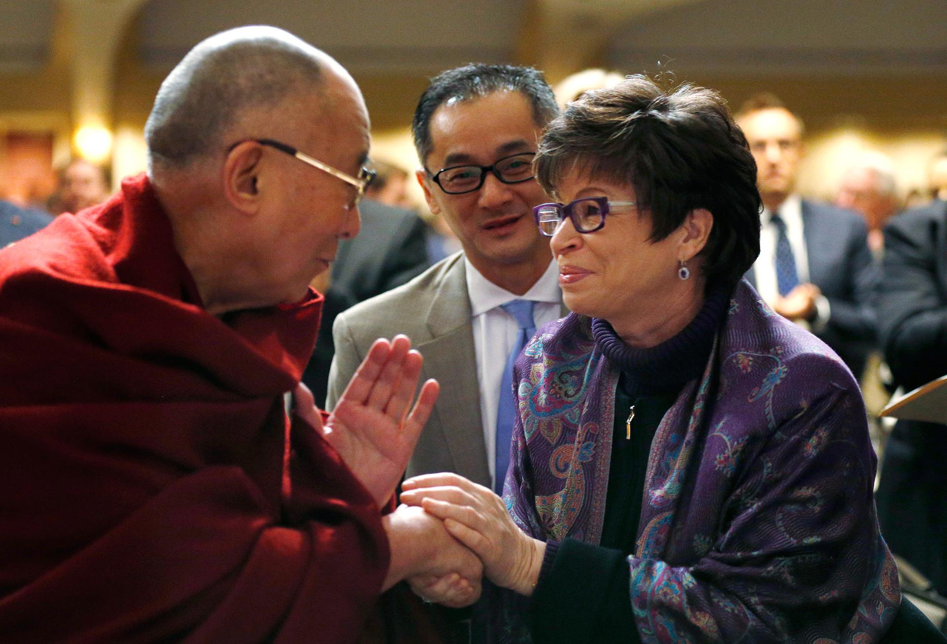Here is the Dalai Lama not meeting with President Obama on February 5, 2015, in Washington. Instead, he is shaking hands with Valerie Jarrett, a senior advisor to the US president. 