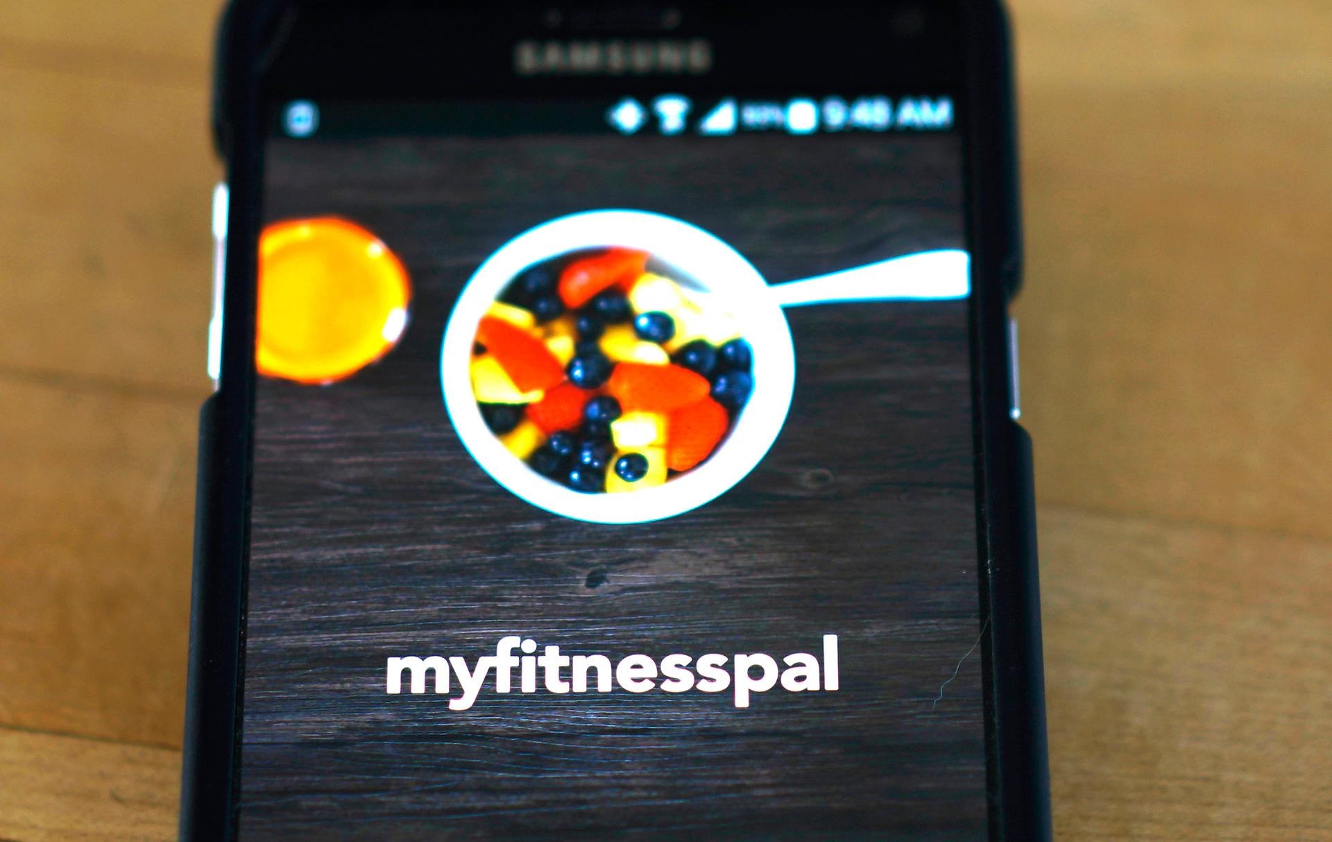 The MyFitnessPal app is seen on a smartphone in Golden, Colorado. Athletic clothing company Under Armour said it would pay $475 million for MyFitnessPal, a free app for tracking food habits and caloric intake.
