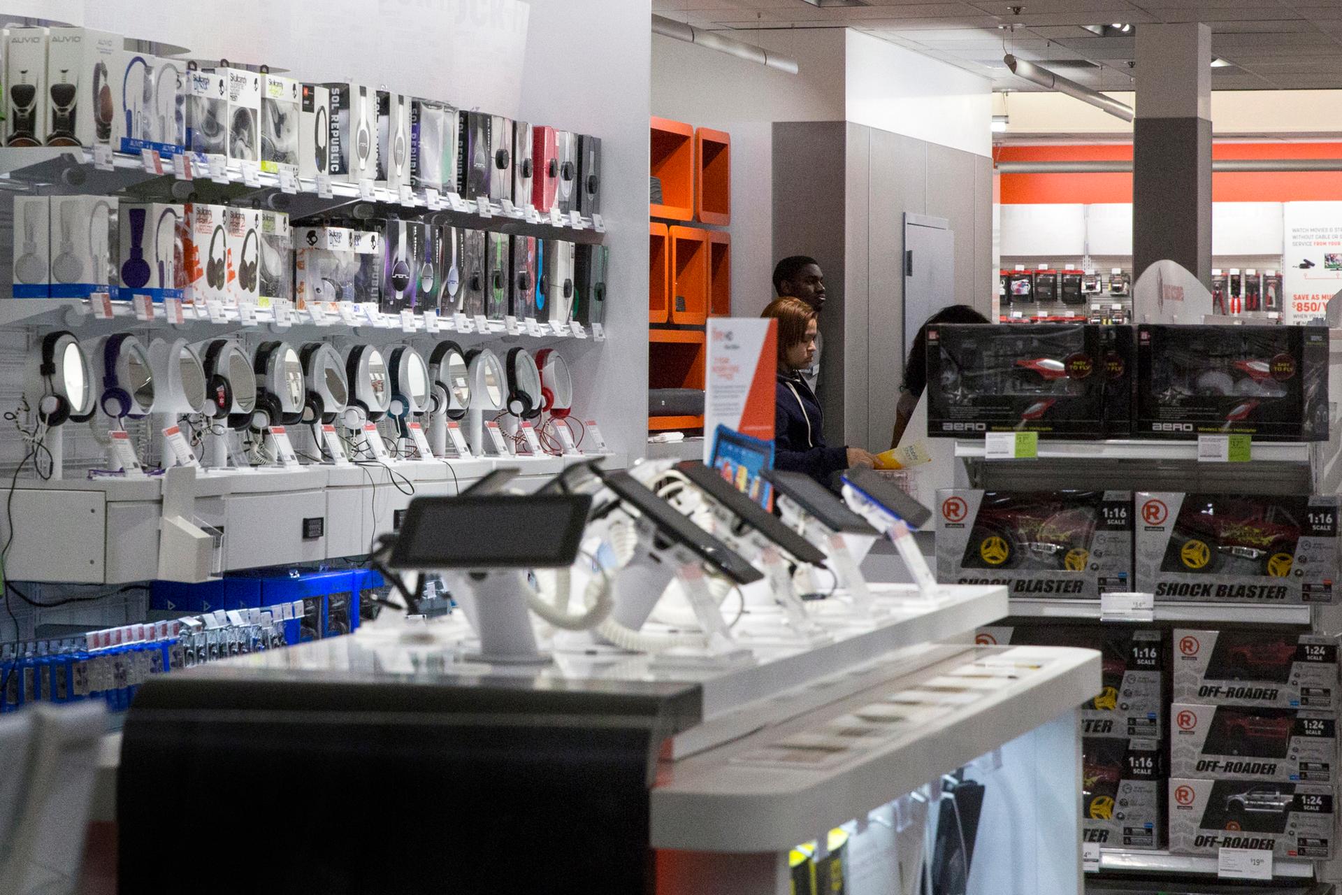 Employees work inside a RadioShack store in New York on February 5, 2015. The company filed for bankruptcy the same day.