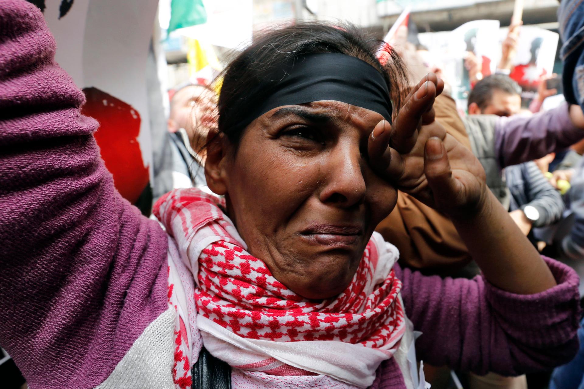 A Jordanian protester cries during a march after Friday prayers in downtown Amman February 6, 2015.