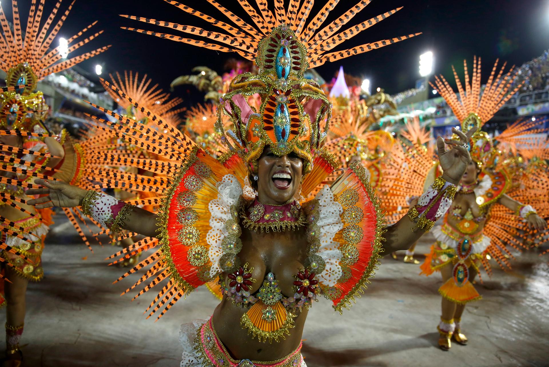 Revelers from the Beija Flor samba school participate in the annual Carnival parade in Rio de Janeiro's Sambadrome on February 17, 2015. 