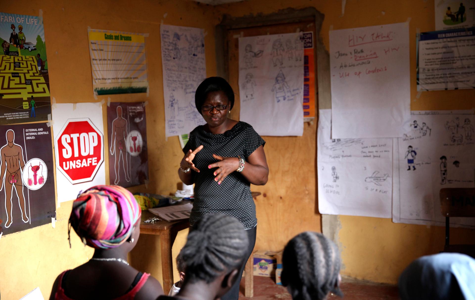 Evelyn Ojwang teaches children about HIV/AIDS at a health clinic within the Korogocho slum in Nairobi, February 16, 2015.