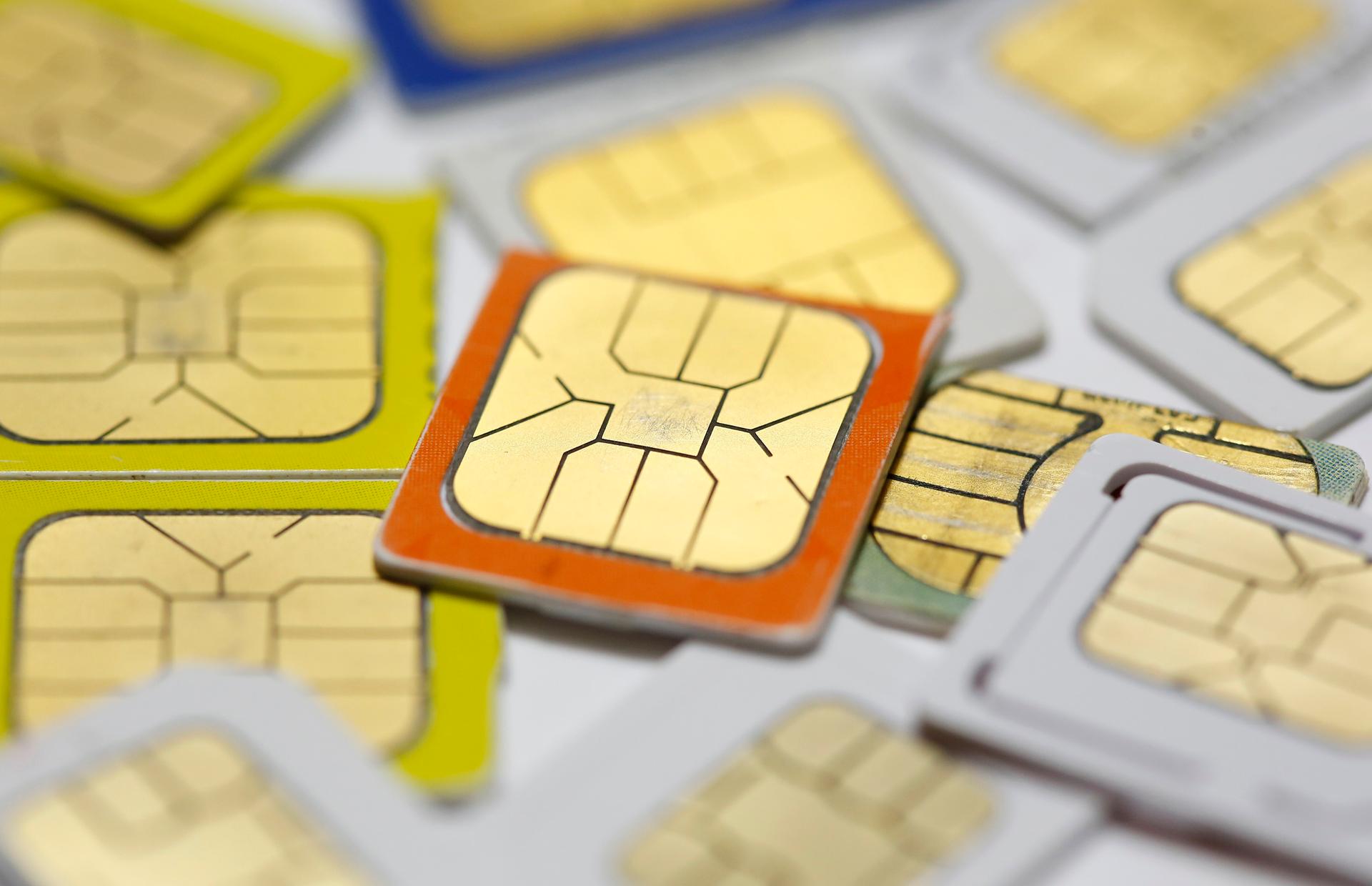 SIM cards lie on a table in this photo illustration taken in Sarajevo February 24, 2015.