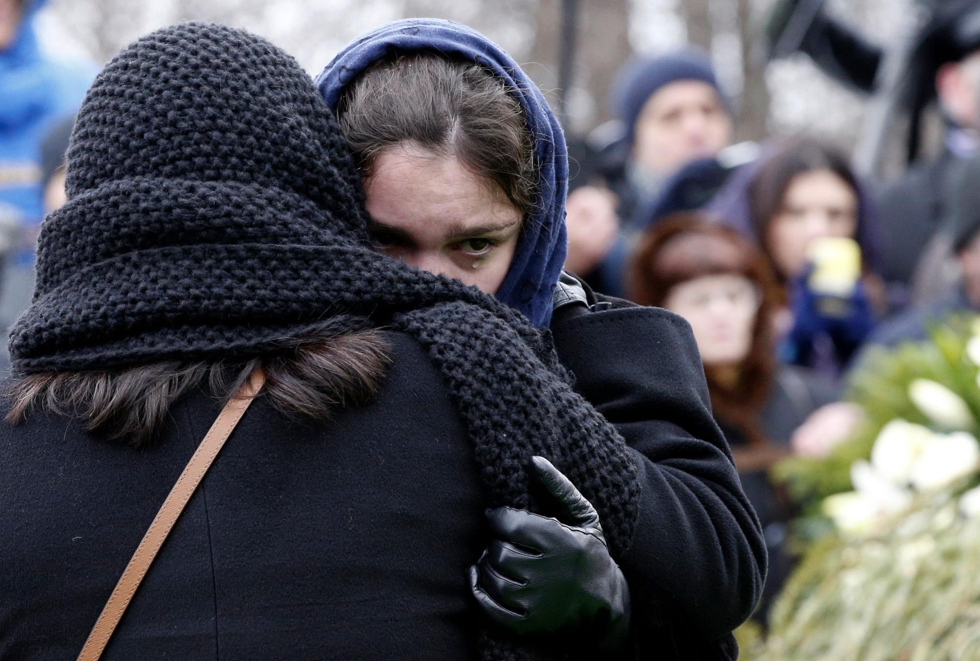Zhanna Nemtsova, daughter of Russian leading opposition figure Boris Nemtsov, reacts during his funeral in Moscow on March 3, 2015.