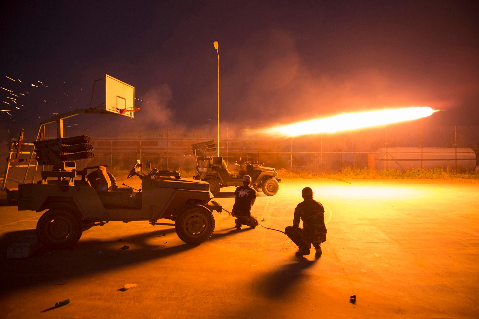Shiite fighters fire a rocket during clashes with ISIS militants in Iraq's Salahuddin province on March 1, 2015. Thousands of Iraqi soldiers and Shiite militiamen sought to seal off ISIS in Tikrit and nearby towns.