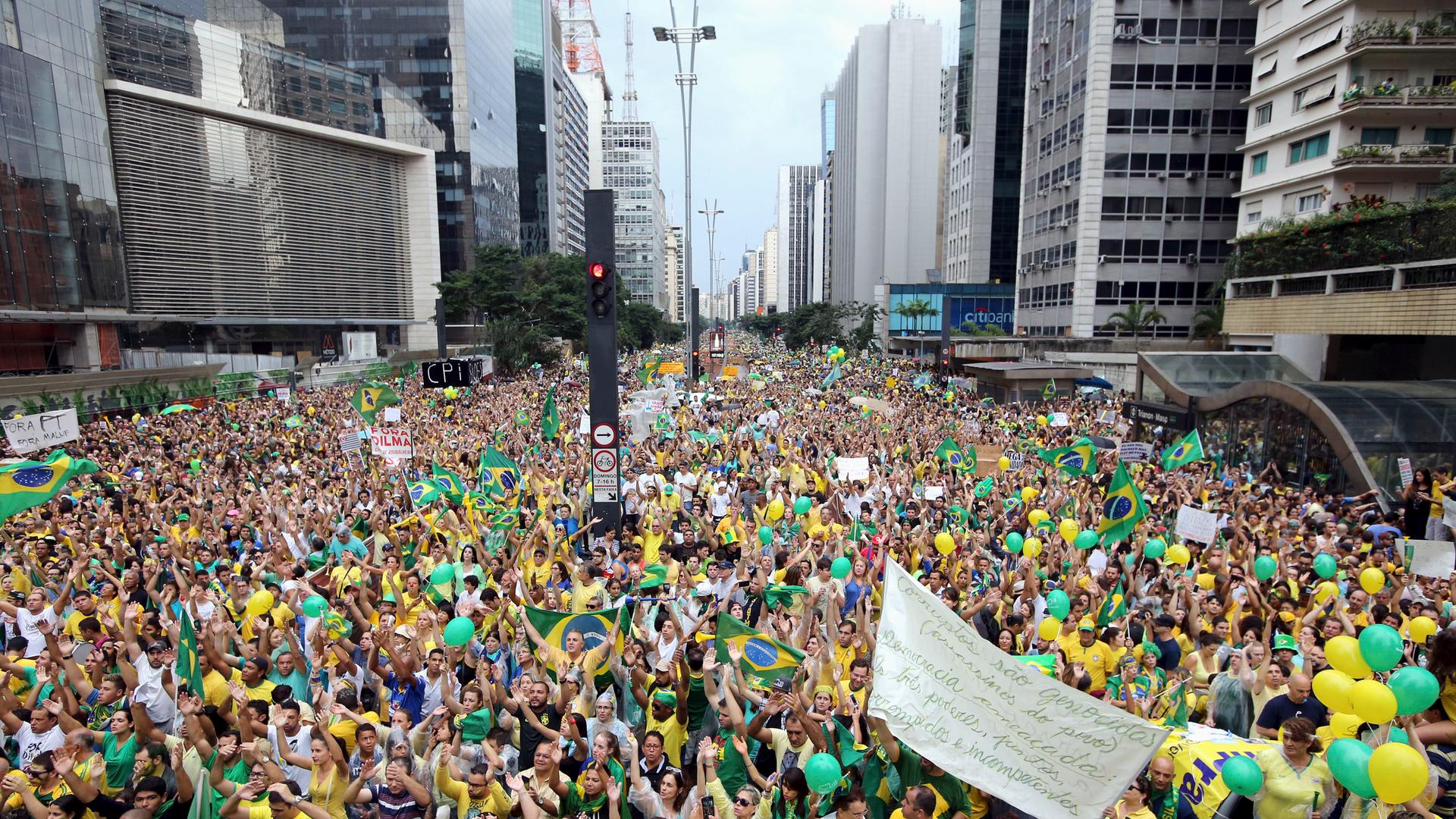 Demonstrators attend a protest against Brazil's President Dilma Rousseff in São Paulo on March 15, 2015. Protest organizers in dozens of cities across Brazil are planning marches to pressure Rousseff over unpopular budget cuts and a corruption scandal tha