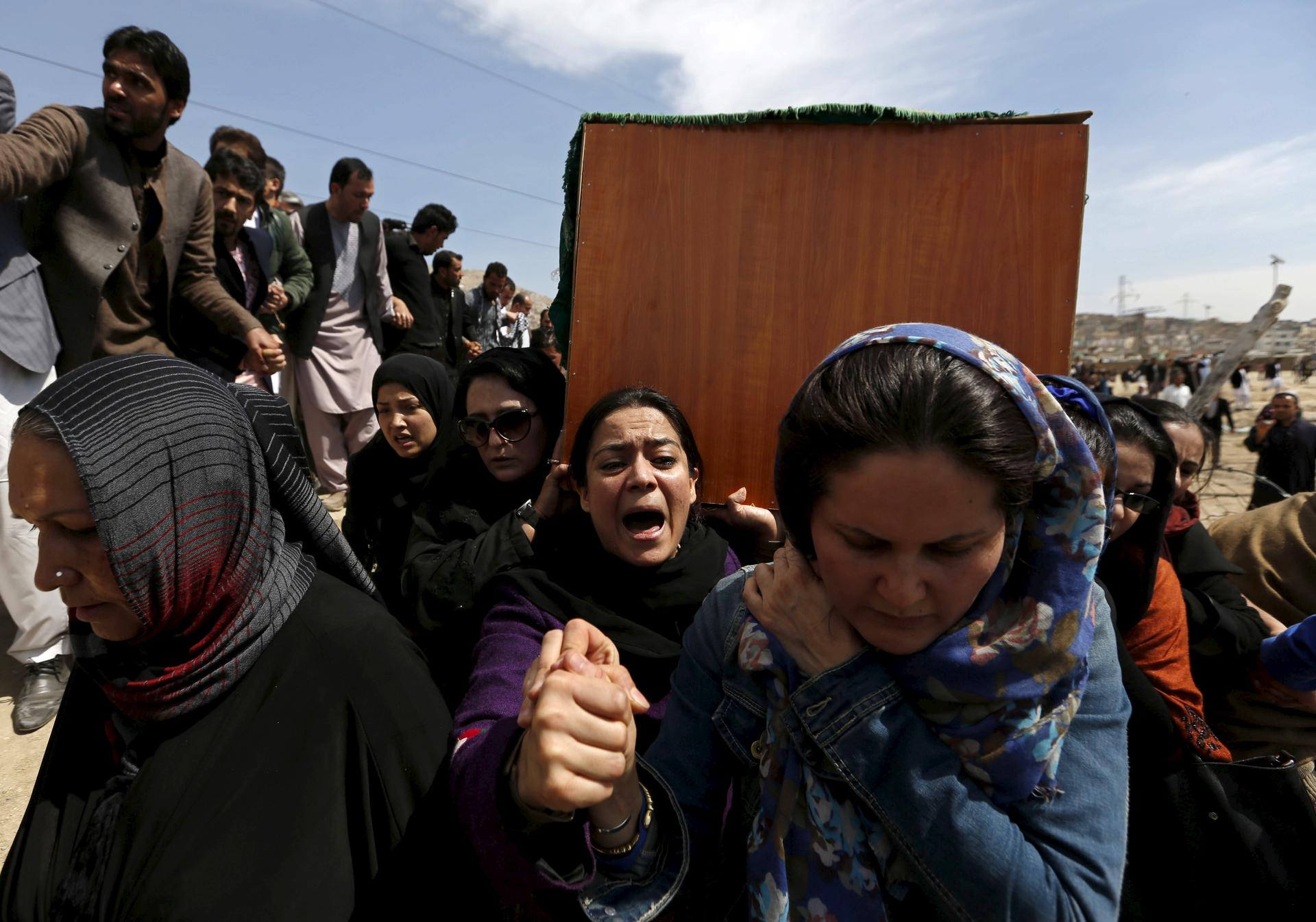 Afghan women's rights activists carry the coffin of Farkhunda, an Afghan woman who was beaten to death and set alight on fire on Thursday, during her burial ceremony in Kabul March 22, 2015