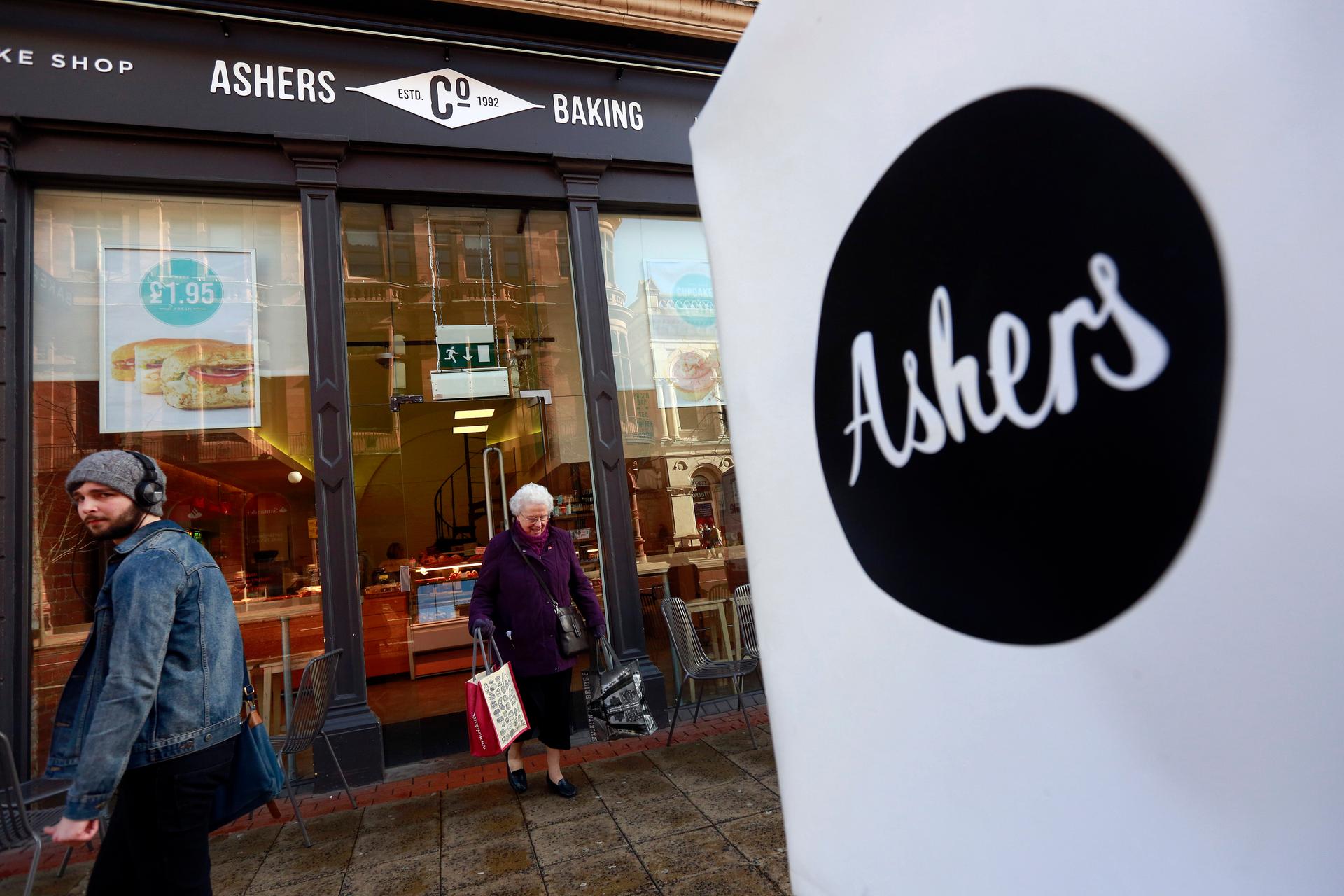A woman leaves Ashers bakery in Belfast, Nothern Ireland, on March 26, 2015. Ashers will face a discrimination case from the Equality Commission after it refused to make a cake bearing a pro-gay marriage slogan.