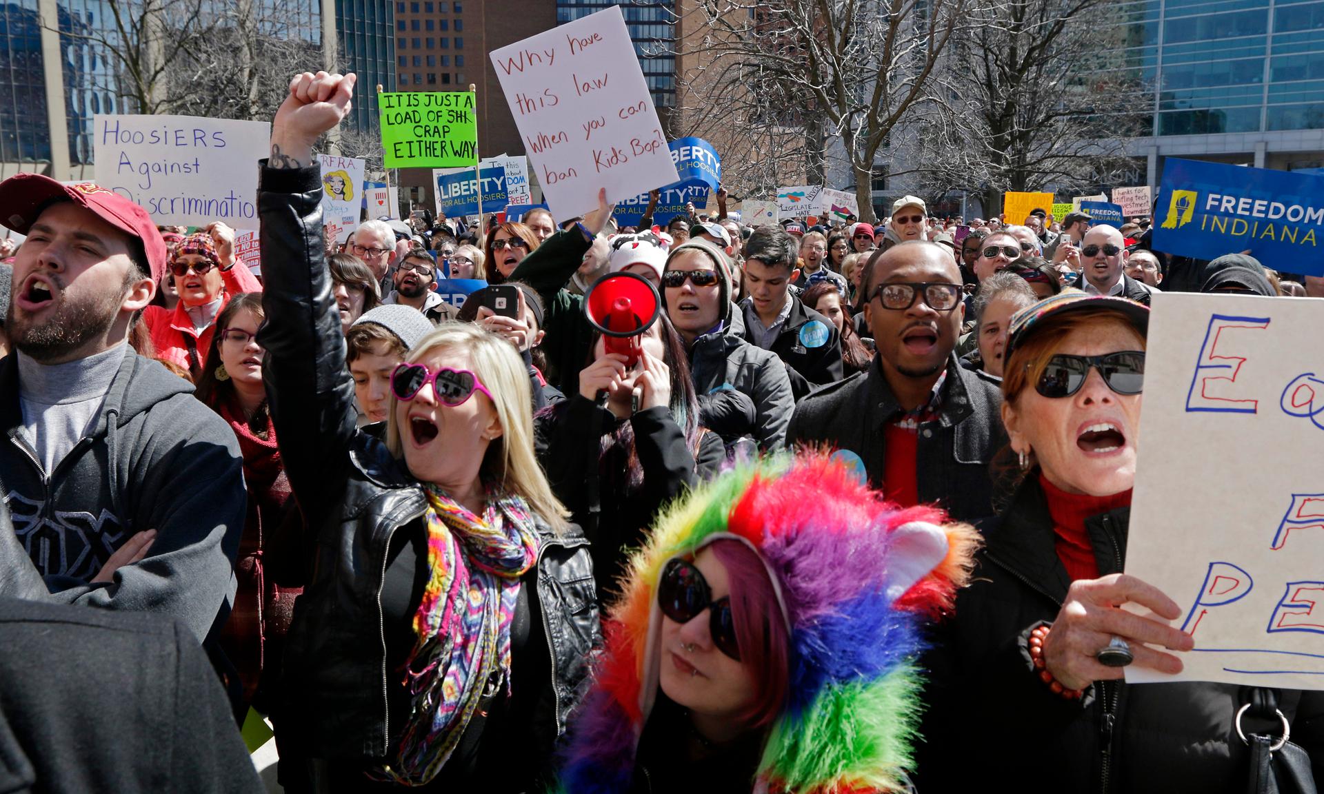 Demonstrators gather at a rally in Indianapolis on March 28, 2015 to protest a controversial religious freedom bill recently signed by Indiana Governor Mike Pence.
