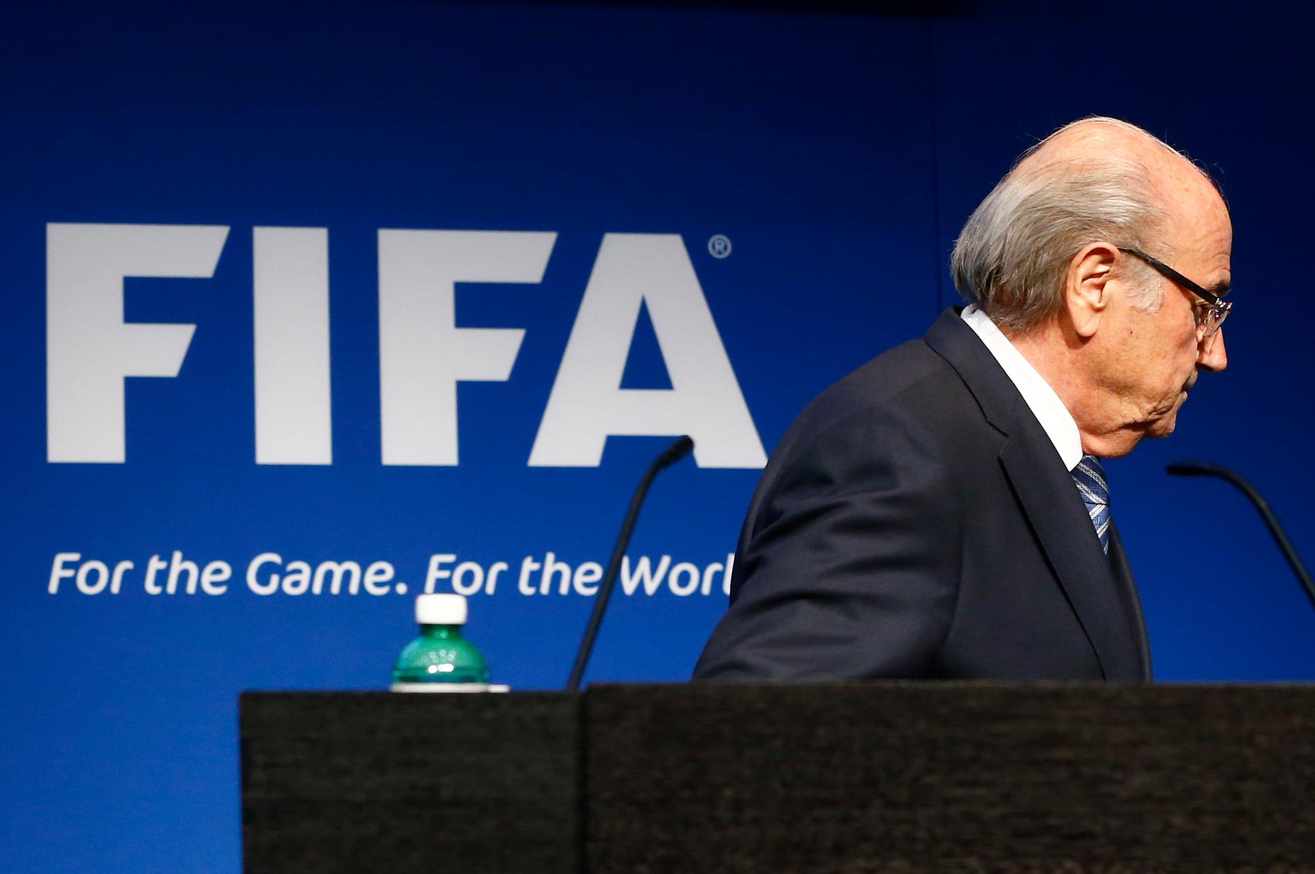 FIFA President Bladder leaves podium after resignation 