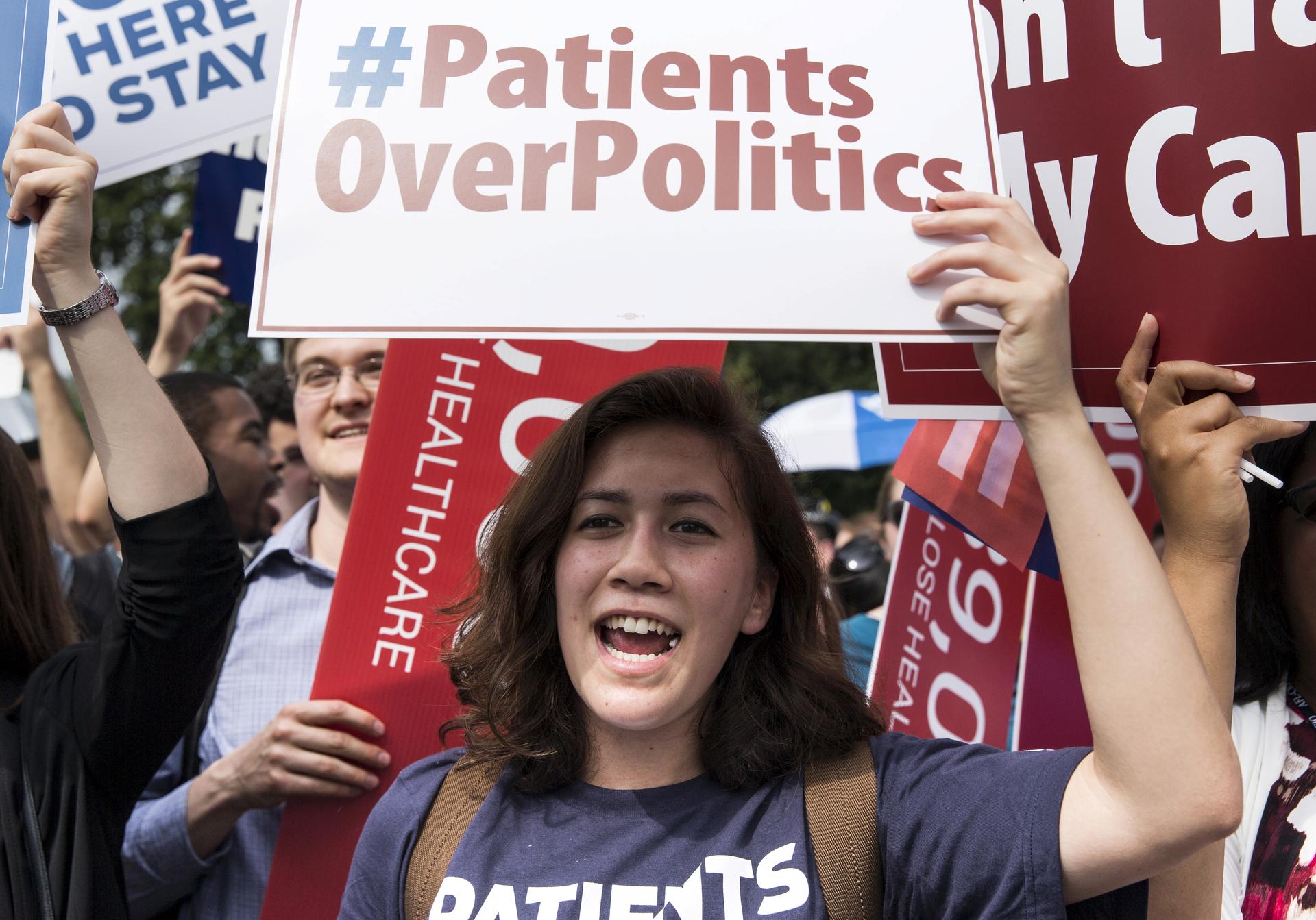 A supporter of the Affordable Care Act celebrates last week after the Supreme Court upheld the law in a 6-3 vote. The Court upheld the nationwide availability of tax subsidies that are crucial to the law's implementation.