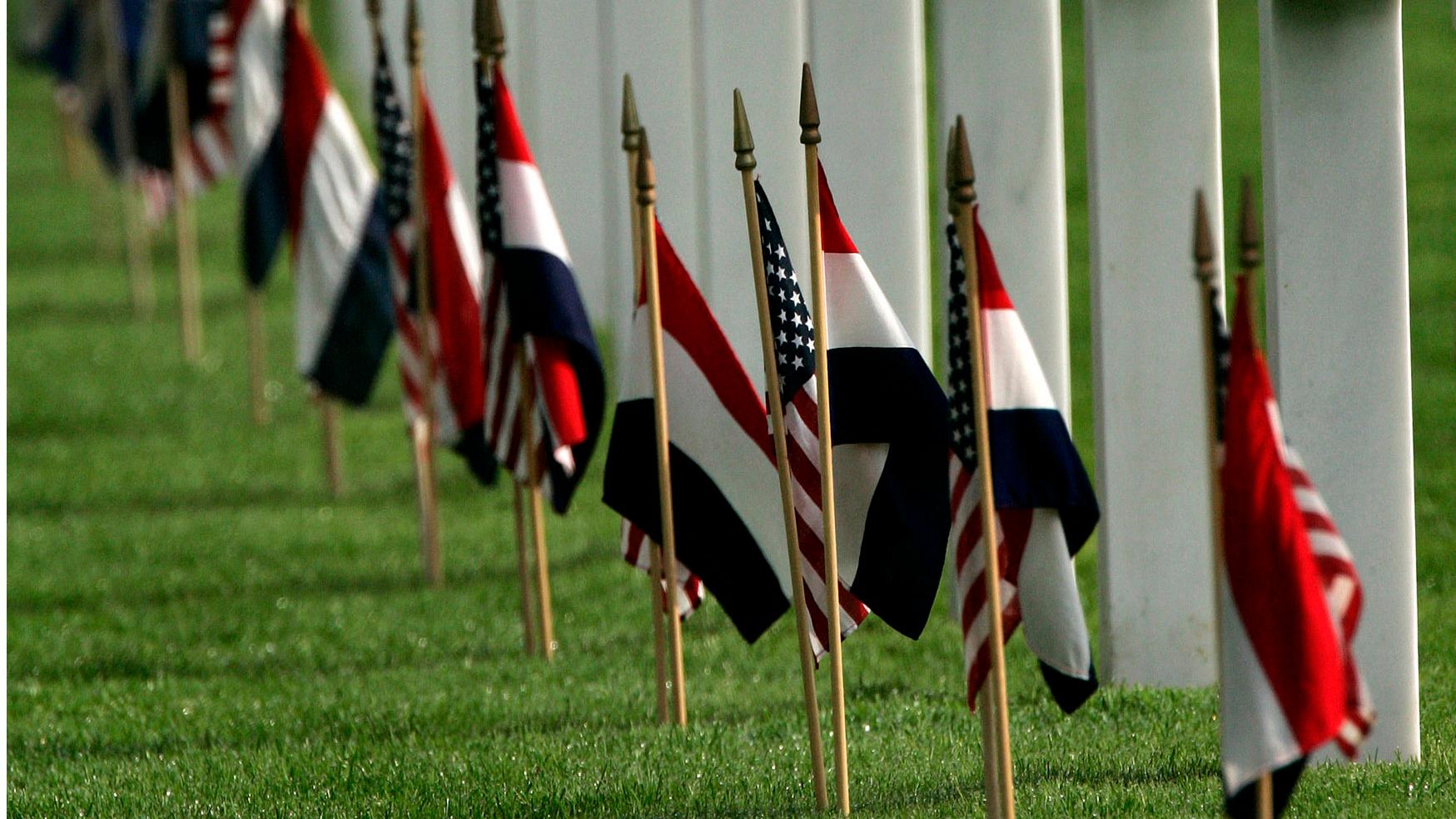 Dutch and U.S. flags decorate the graves at the American Cemetery and Memorial in Margraten.