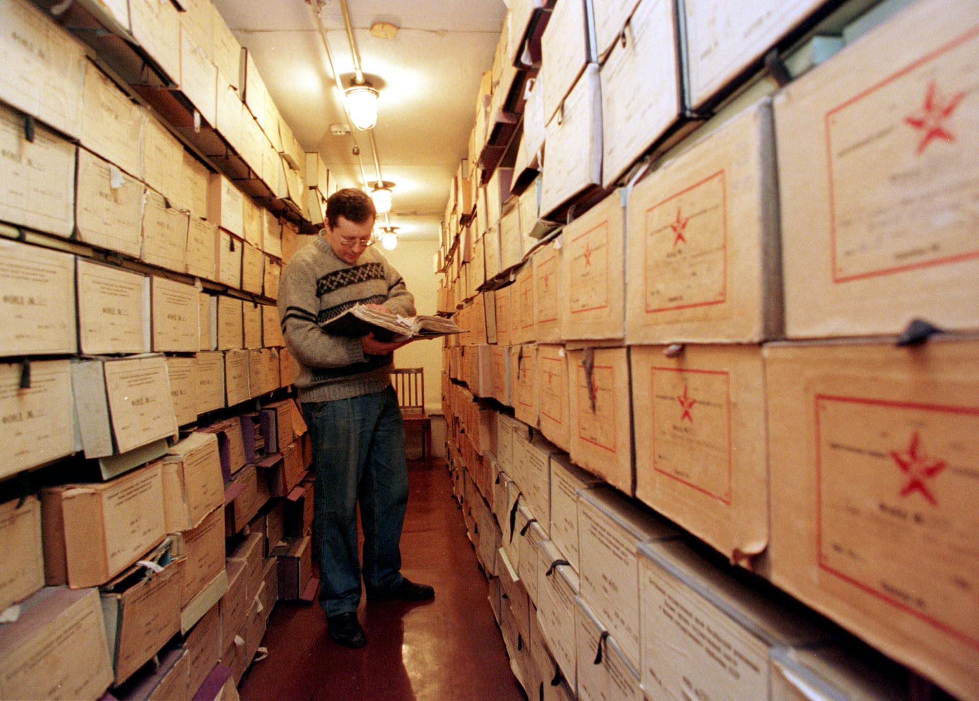 An employee works with documents at the Russian State Archives.