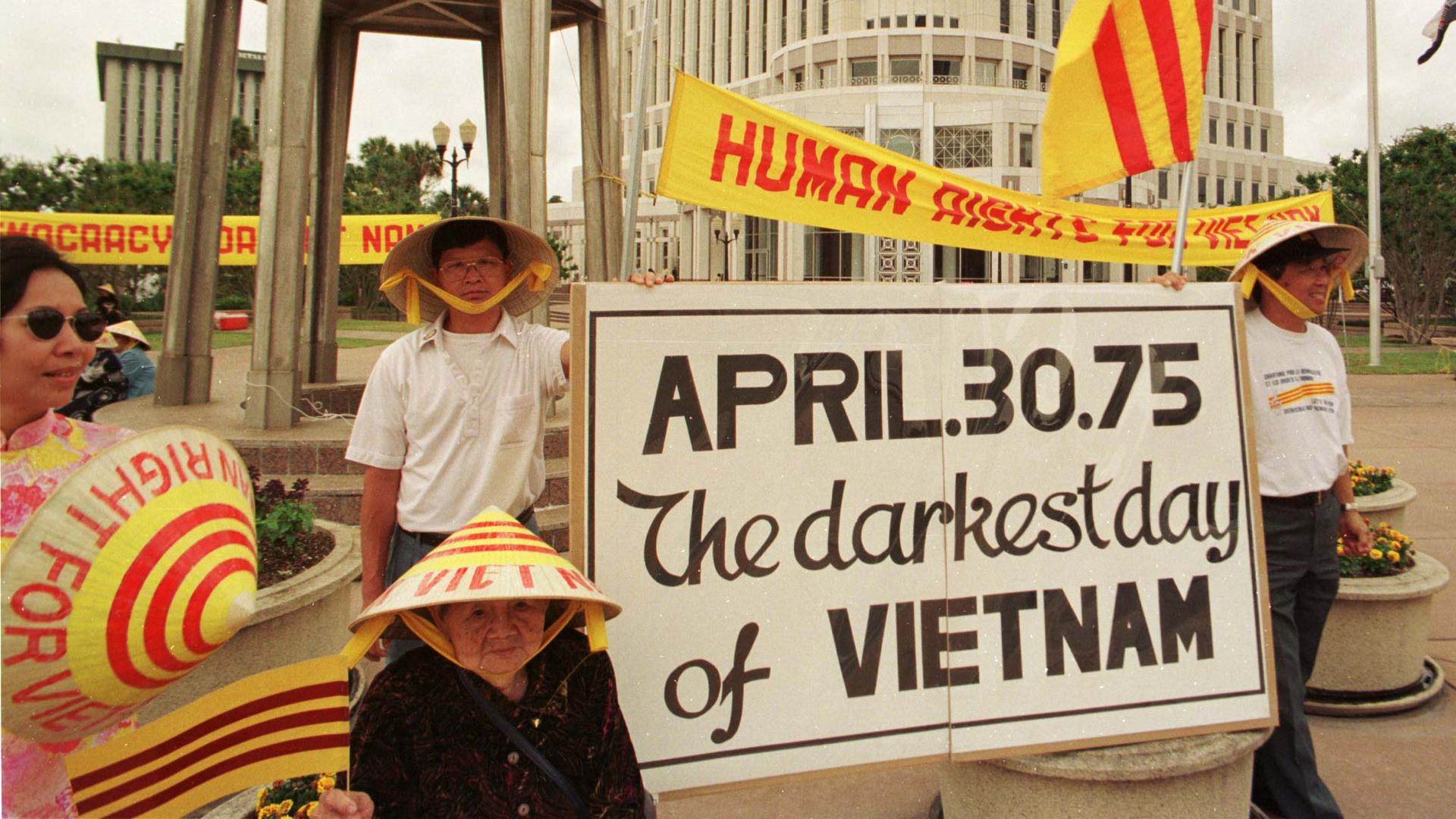 Several dozen Vietnamese demonstrators protest against what they described as human rights violations in the former South Vietnam on April 30, 1998 at city hall in Orlando, Florida.