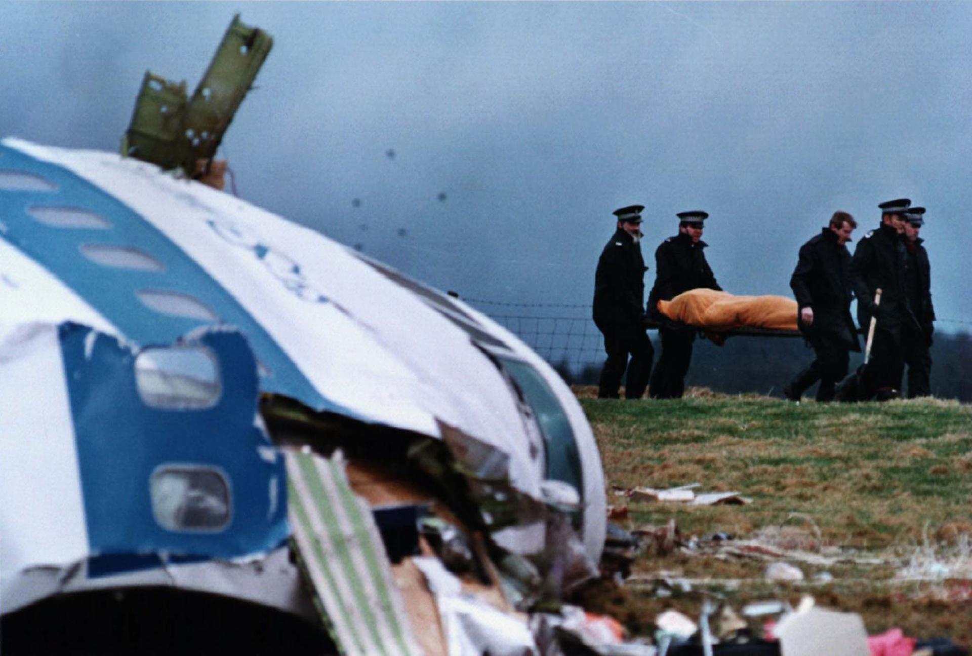 File photo from December 22, 1988, shows rescue personnel carrying a body away from the site of the crash in Lockerbie. A total of 270 people were killed when a bomb ripped apart Pan Am flight 103 over the Scottish town of Lockerbie in 1988.