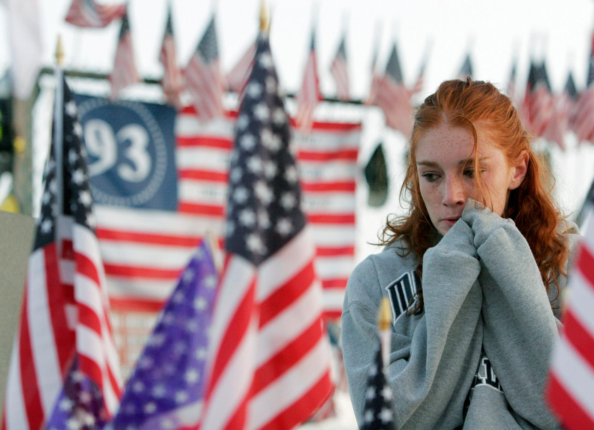 Courtney Ball, 19, of Sommerville, New Jersey, cries at the Flight 93 Temporary Memorial just outside Shanksville, Pennsylvania, September 11, 2005.