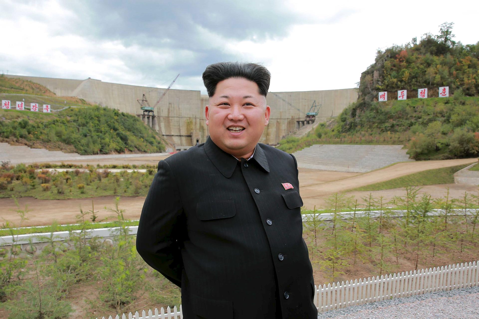 North Korean leader Kim Jong Un smiles during his visit to the construction site of the Paektusan Hero Youth Power Station near completion in this undated photo released by North Korea's Korean Central News Agency (KCNA) in Pyongyang September 14, 2015.