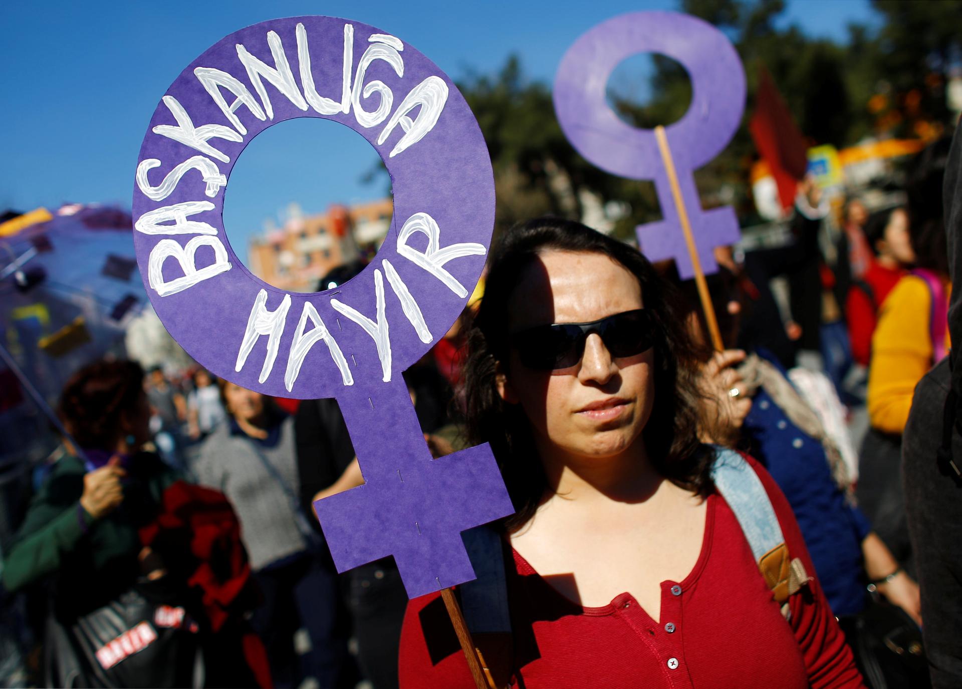 A demonstrator holds a placard that reads: "No to Presidency" during a Women's Day rally in Istanbul, Turkey, March 5, 2017.