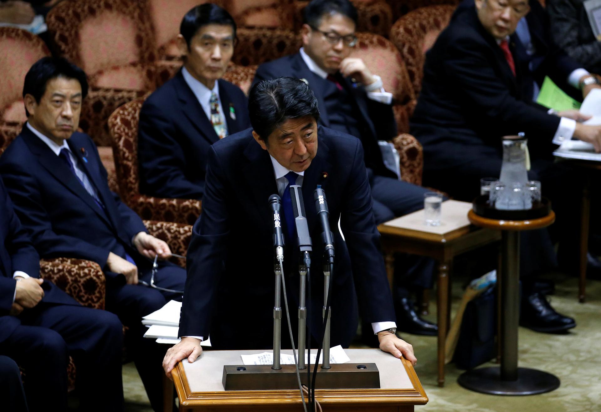 Japan's Prime Minister Shinzo Abe (C) speaks at the upper house parliamentary session after reports on North Korea's missile launches, in Tokyo, Japan, March 6, 2017.