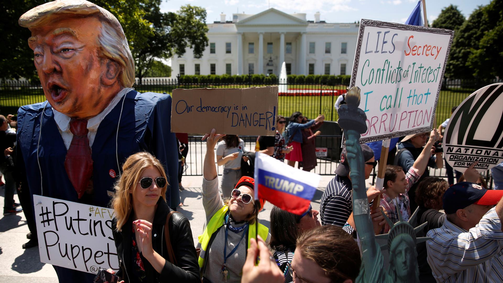 Protesters outside the White House, May 10th 2017. One sign says “Our democracy is in danger.”