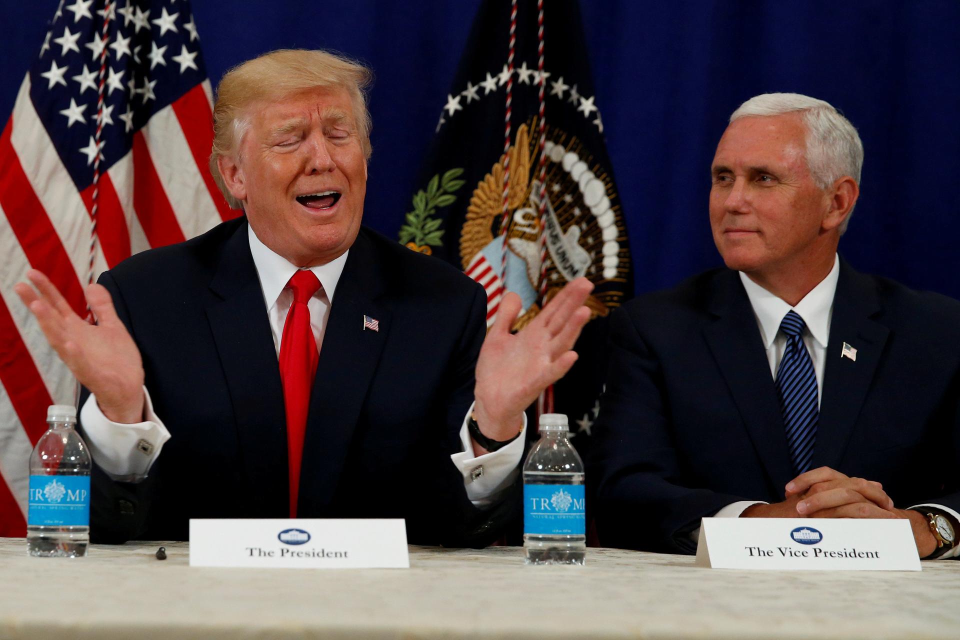 President Donald Trump and Vice President Mike Pence speaking to reporters after a security briefing at Trump's golf estate in Bedminster, New Jersey, on Aug. 10.