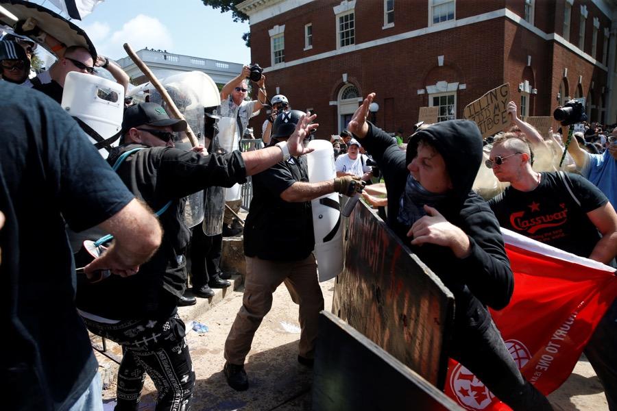 Members of white nationalists clash against a group of counter-protesters in Charlottesville, Virginia