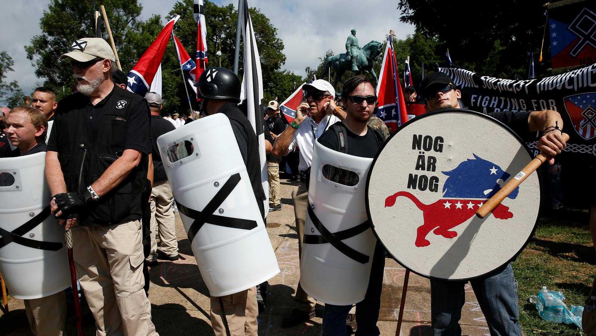 White supremacists stand behind their shields at a rally in Charlottesville, Virginia, U.S., August 12, 2017. 