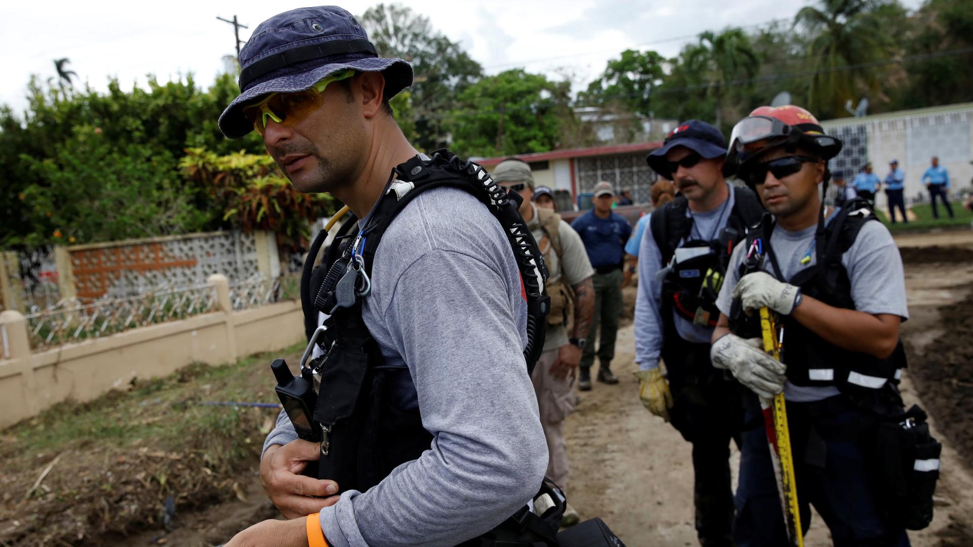 Members of the Federal Emergency Management Agency (FEMA) “Urban Search and Rescue” team conduct a search operation in an area hit by Hurricane Maria in Yauco, Puerto Rico on September 25, 2017.