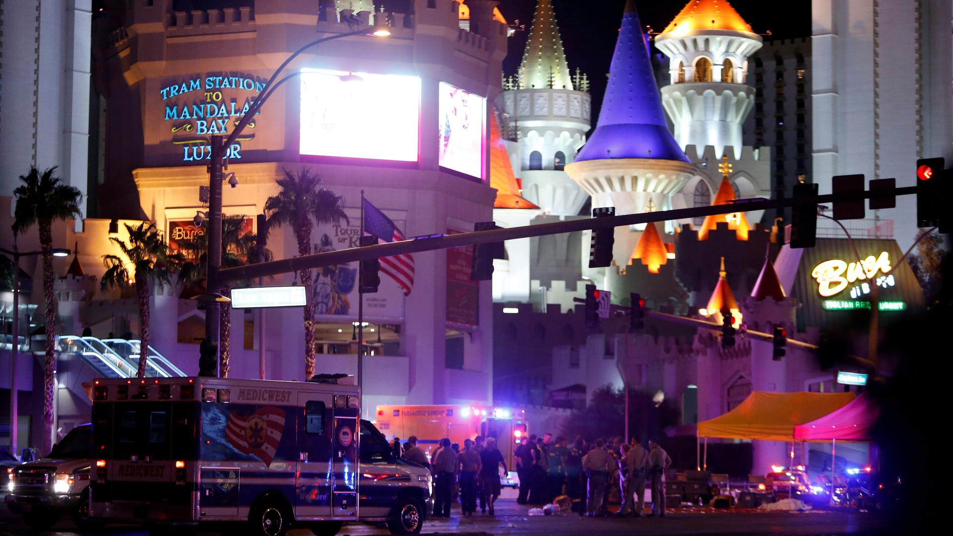 Las Vegas Metro Police and medical workers stage in the intersection of Tropicana Avenue and Las Vegas Boulevard South after a mass shooting