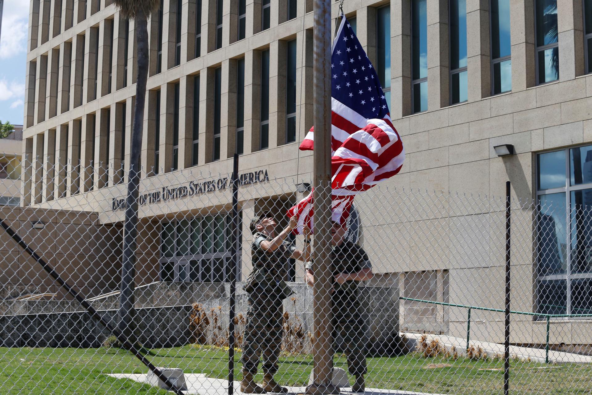 US Marines raise the American flag at half-staff at the US Embassy in Havana, Cuba, on Oct. 2, 2017.
