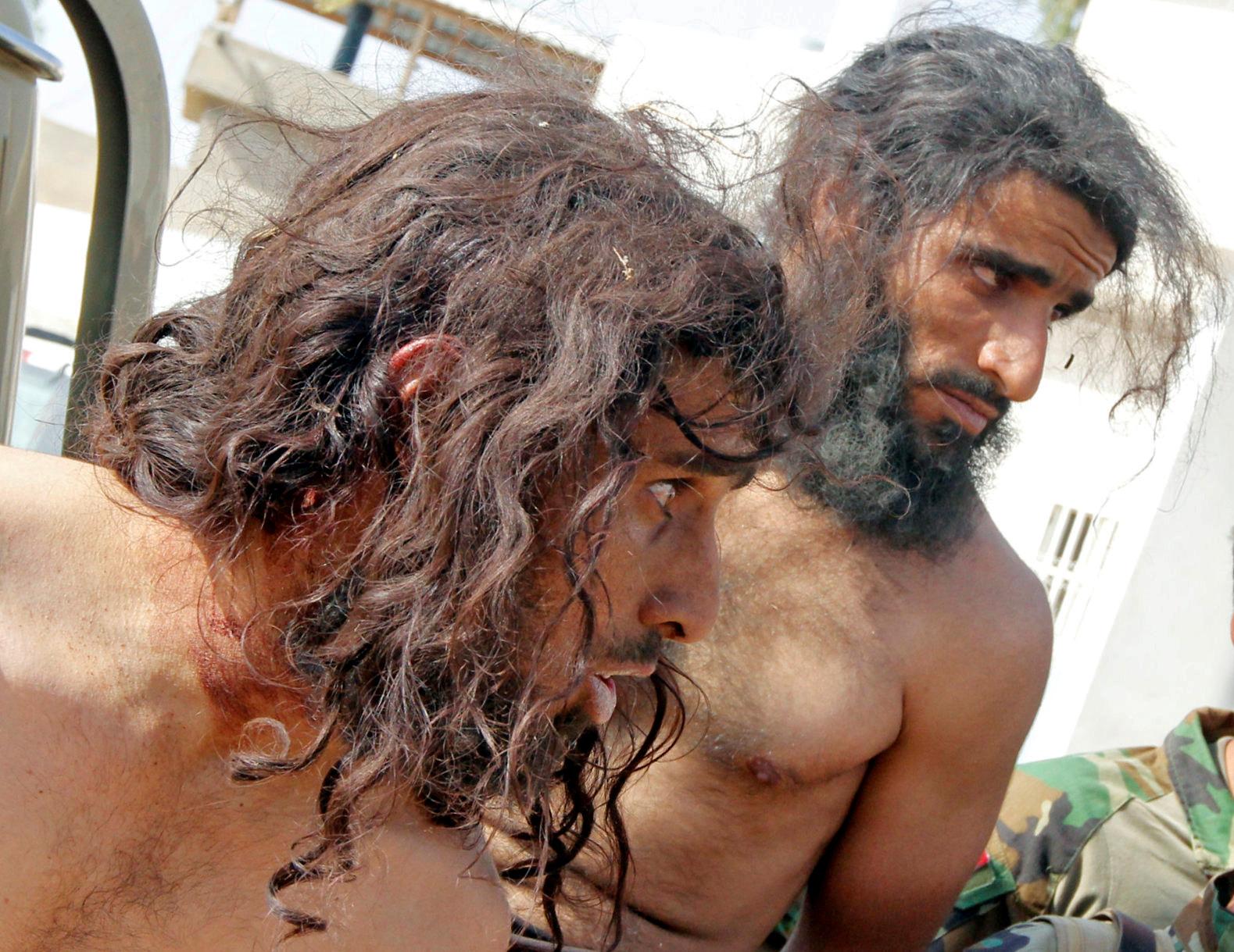 Captives suspected of being Islamic State militants are seen southwest of Kirkuk, Iraq.