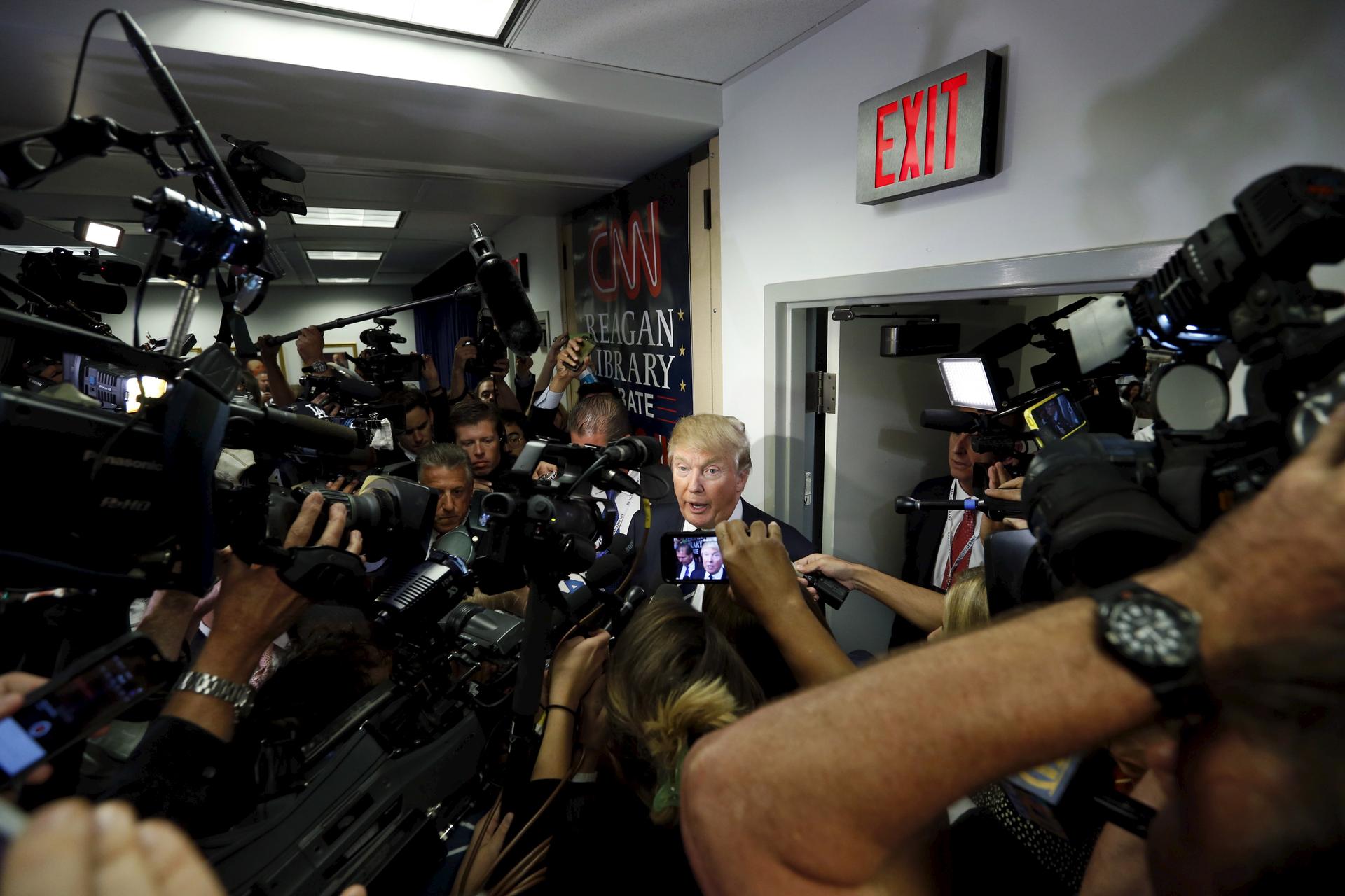 Donald Trump talks to members of the press after the second official Republican presidential candidates debate of the 2016 U.S. presidential campaign at the Ronald Reagan Presidential Library in Simi Valley, California, September 16, 2015.
